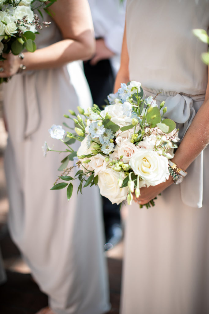 Whimsical bridesmaids’ bouquets of summer flowers by Cricket Newman Designs. 