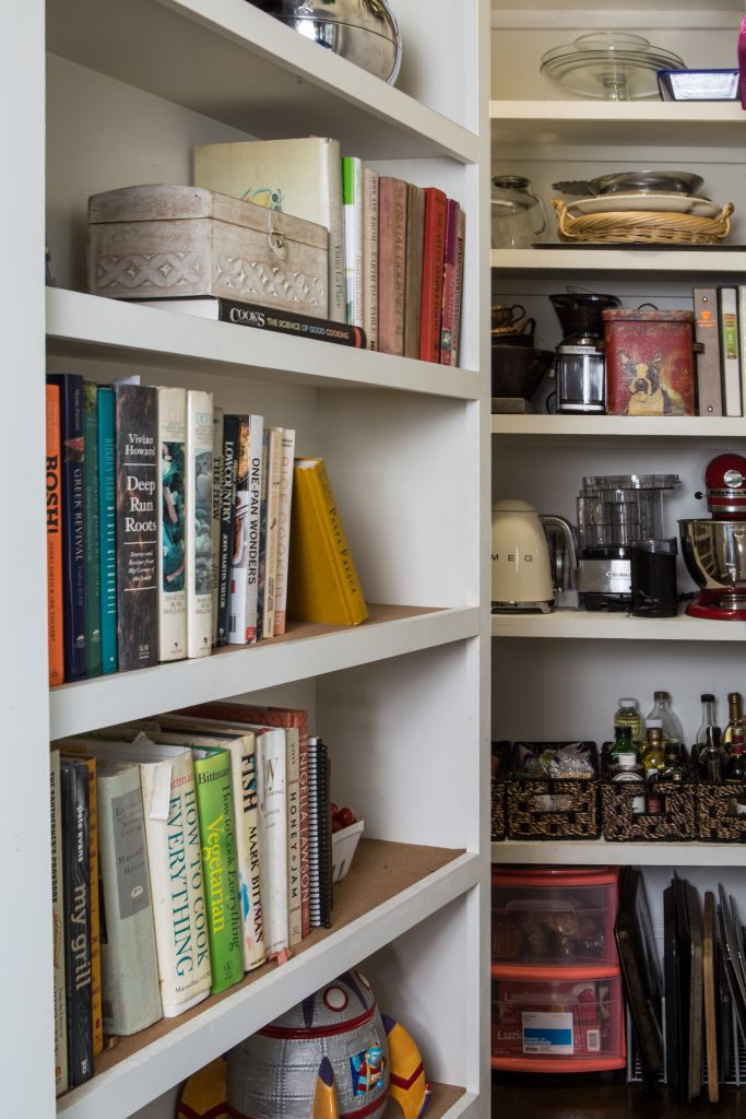 Tim designed the unexpected Murphy bookcase that hides the ample pantry. 

