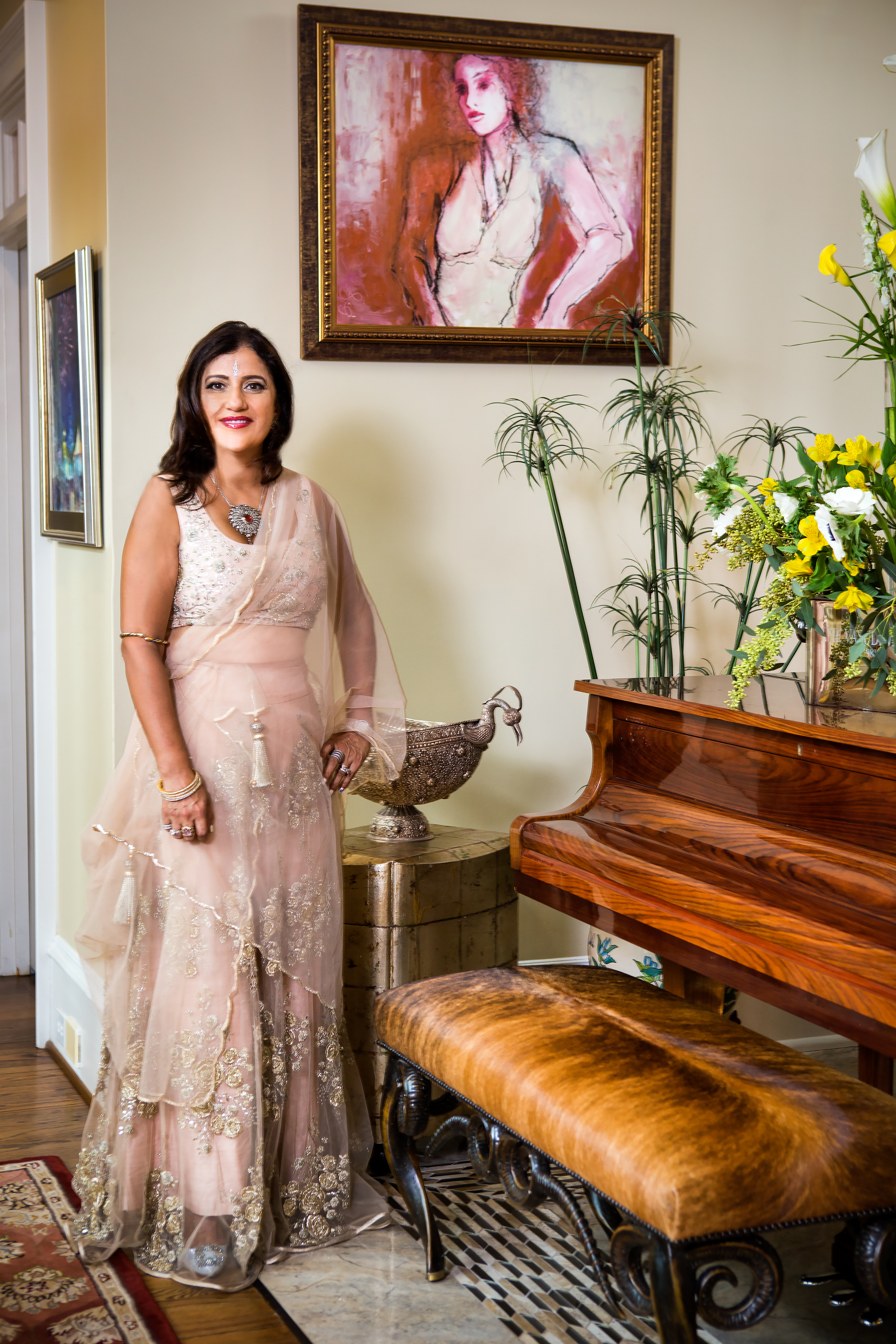 Bhavna poses regally in her living room wearing a Sharara pant set by designer Payal Singal and a mid-19th century pink pear diamond necklace set. 