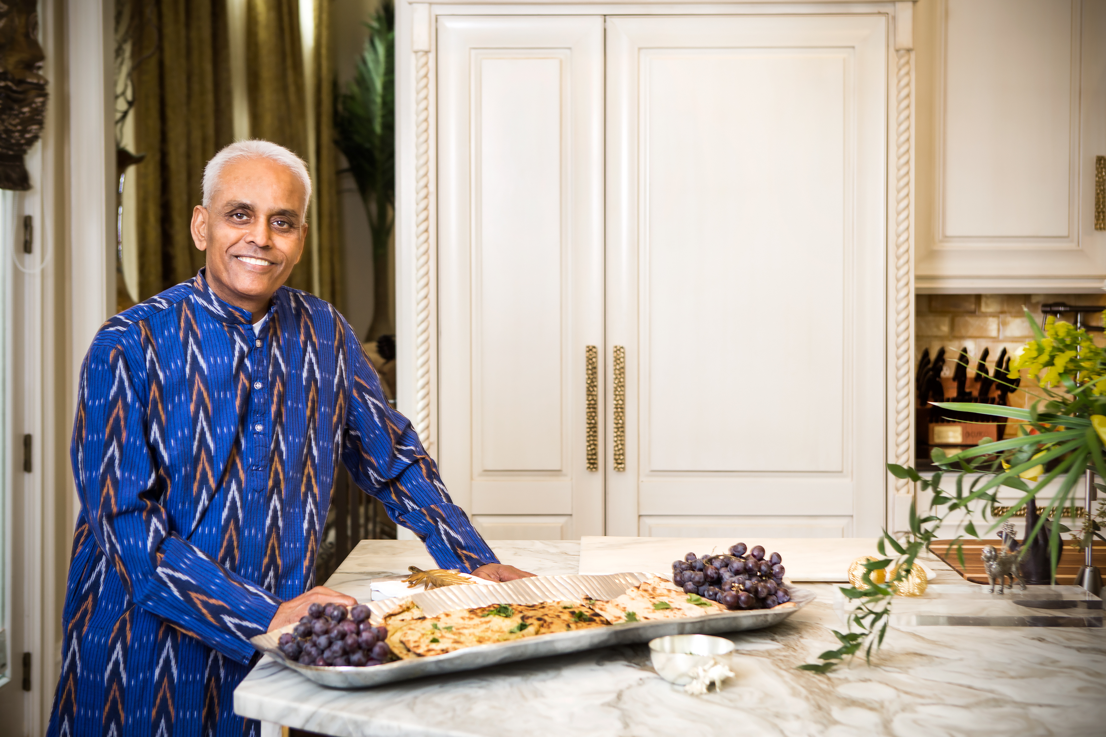 Raj Aluri — who is also from India, but has lived in Columbia for 43 years — wears the traditional kurta. Flatbread is a traditional Indian appetizer. 
