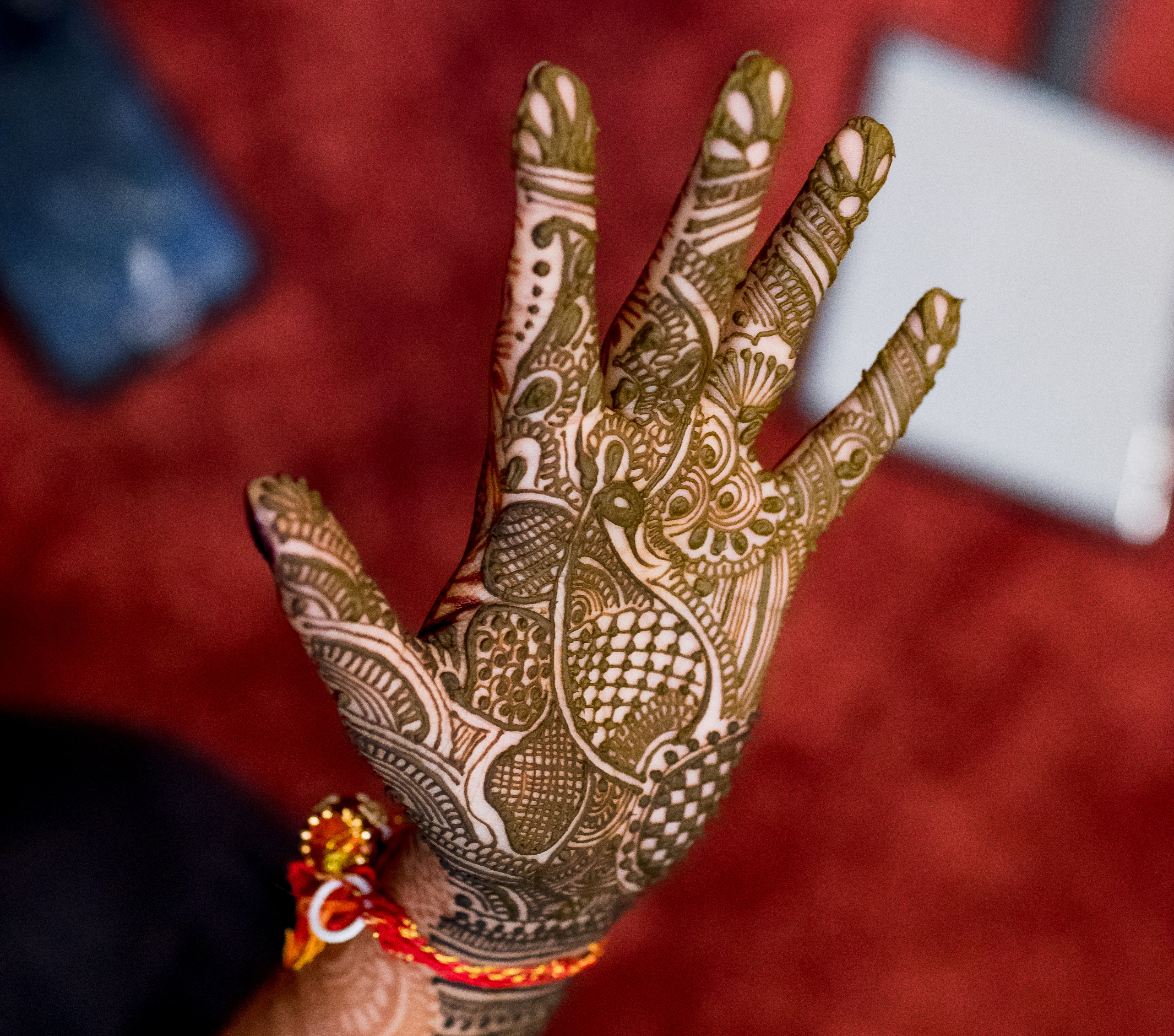 Indian weddings begin with seven days of pre-wedding rituals. The first night is Mehndi, or henna, night when red mehndi stain is applied to the bride’s hands and feet in elaborate designs.

