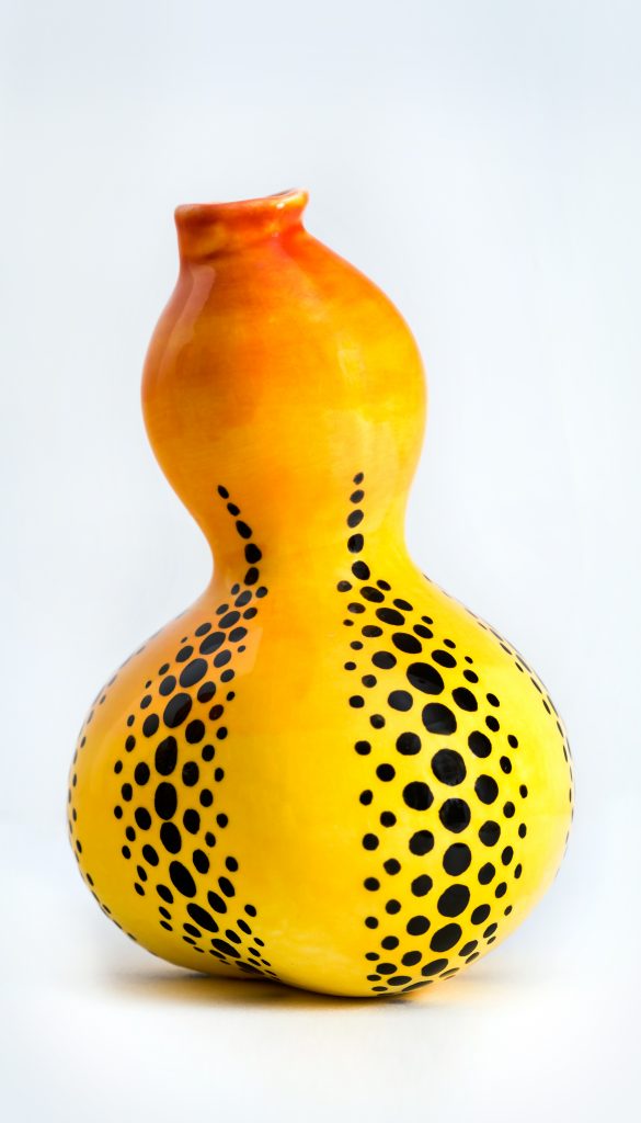 Betsy’s inspiration for this yellow vase was artist Kusama, a pop artist during the Andy Warhol era. The use of dots was from the “Infinity Rooms.”