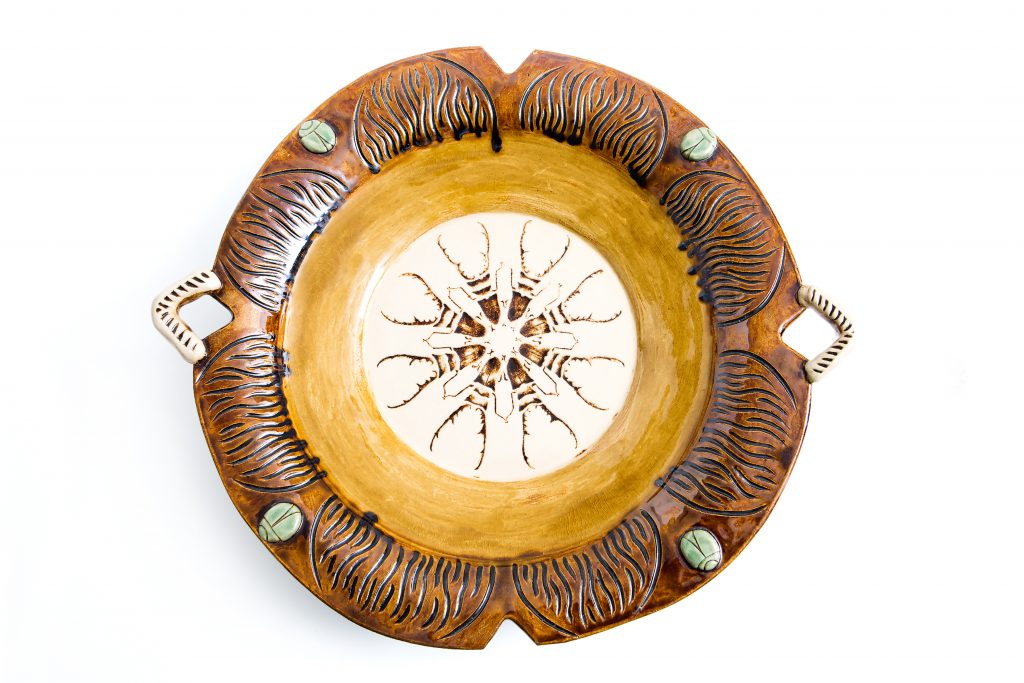 Betsy Kaemmerlen’s longhorn beetle plate was made in a workshop with Mac McCusker from Asheville. Beetles were carved in the depressions and then stained.