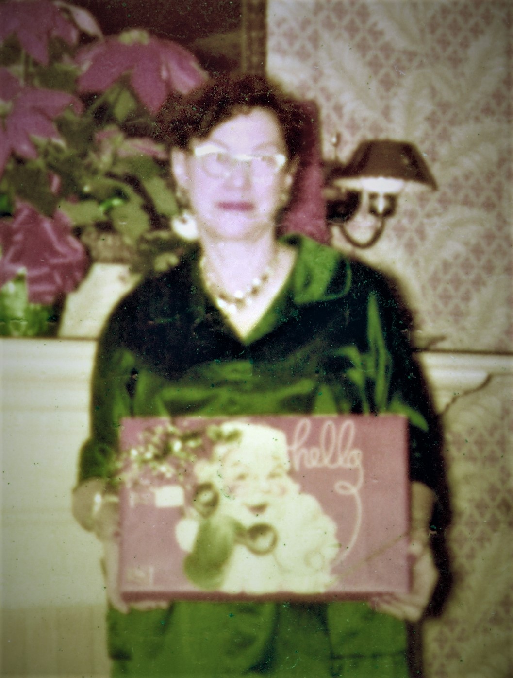 After Hazel Weisse retired, she continued to live in the garage apartment behind the Sunset Lodge building that was purchased by Jack and Bettye Marsh as their home. In this picture taken in 1970, Hazel holds a Christmas present. The picture is owned by Tammy Marsh Foxworth who was 12 years old when her parents bought the Sunset Lodge building.