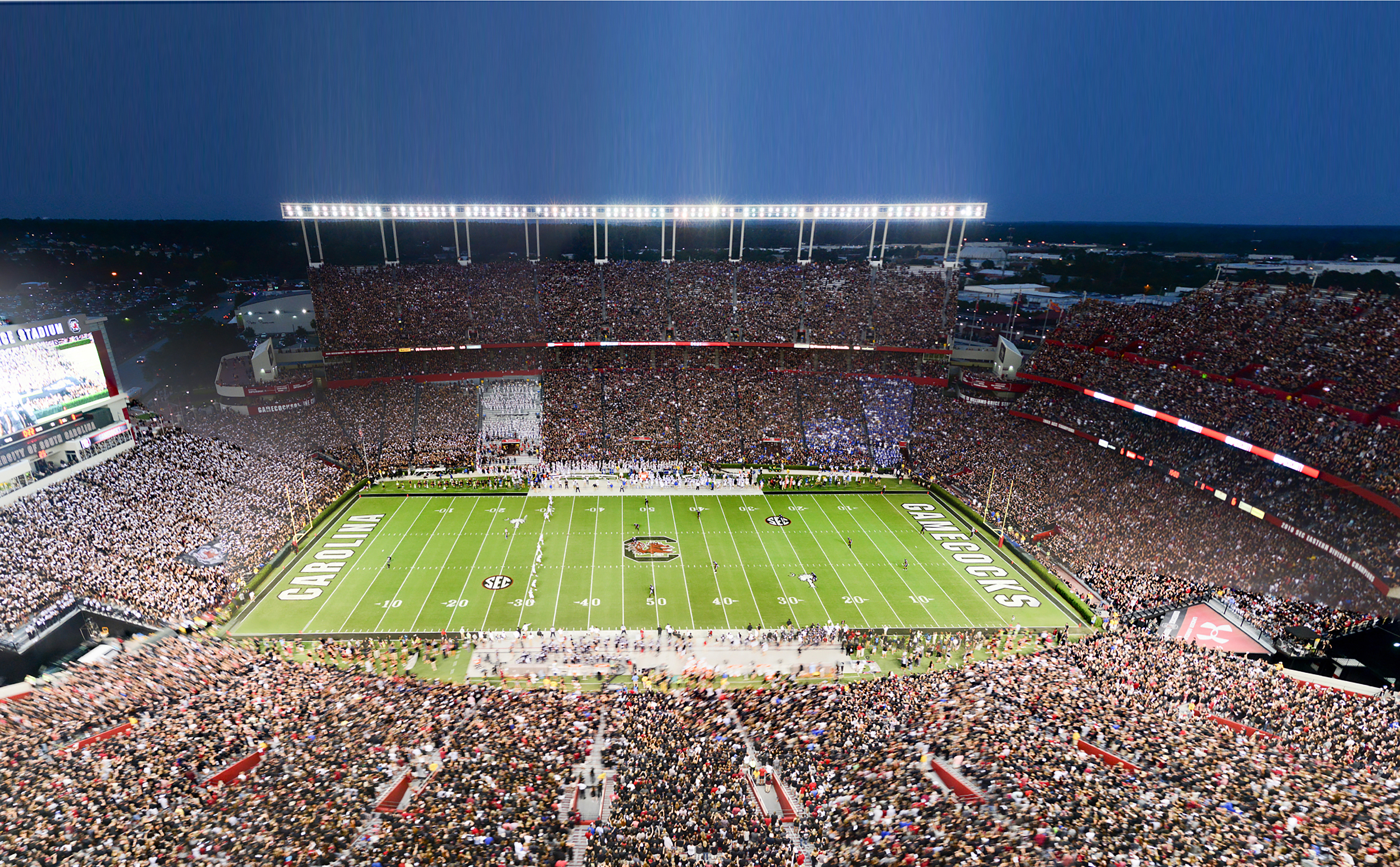 Close to 85,000 people are in Williams-Brice Stadium on any given game day at kick off! This includes players, fans, concession workers, and television crews. Every year, new parking passes are designed for 32 various types of parking. Jim Petrus, who has worked for 40 years with USC athletics, says planning for the August kickoff begins in May. Jim is responsible for overseeing and coordinating grounds crews, the highway patrol, a 100-plus-member parking crew and more. Photography courtesy of USC Athletics