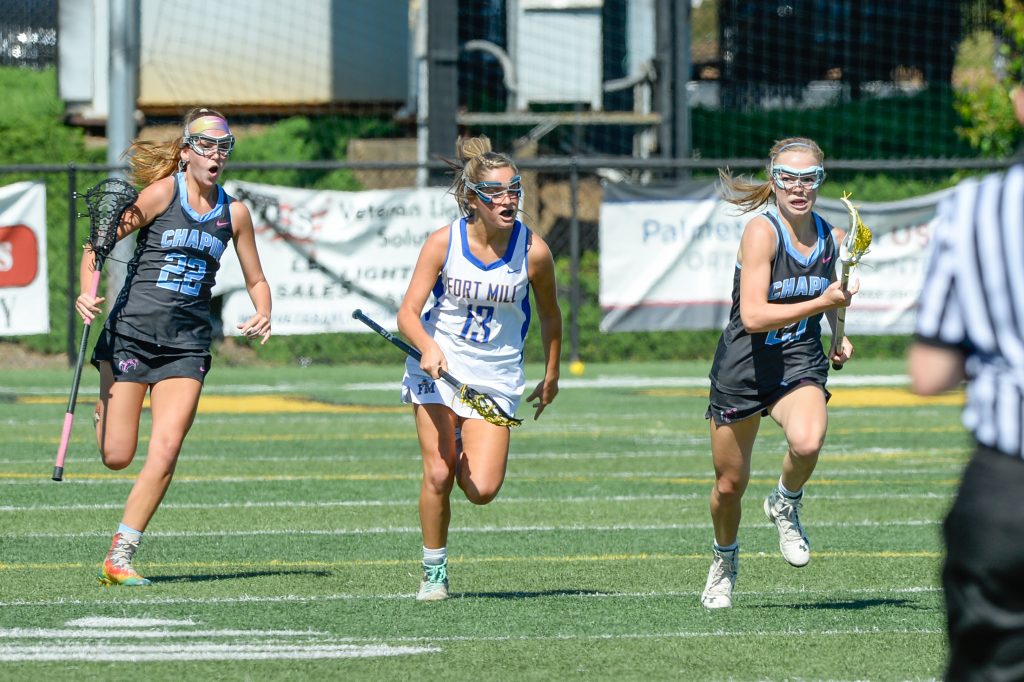 Alex Miller, far right, #21, and Keelan Molony, far left, #22, helped lead the Chapin girls’ lacrosse team to defeat Fort Mill 9-6 to win the Class 5A championship. Fort Mill player is #13 Sawyer Wilcox. 