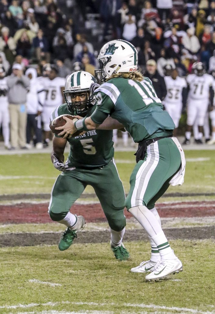 Dutch Fork’s Ty Olenchuk hands off to the team’s running back, Ron Hoff. Dutch Fork football finished 13-0 with a 25-game winning streak dating back to last season. They ranked No. 9 in USA Today’s “Super 25” poll