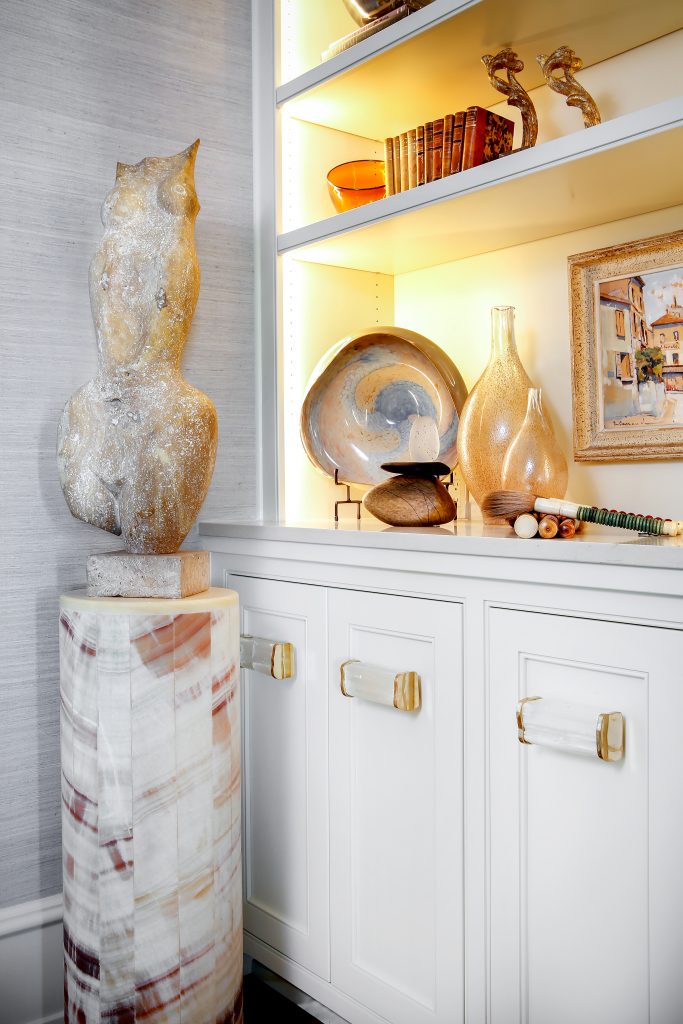 In Lou Kennedy’s living room, the star of the cabinetry is selenite rock crystal hardware with brass end caps by Matthews Studio. 