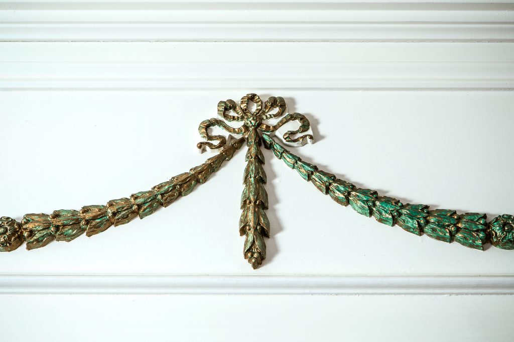 A classical gilded swag detail with acanthus leaves and ribbon drops is one of the features crafted by Doug Vinson for Jack Brantley’s historic Camden home, built in 1810. 