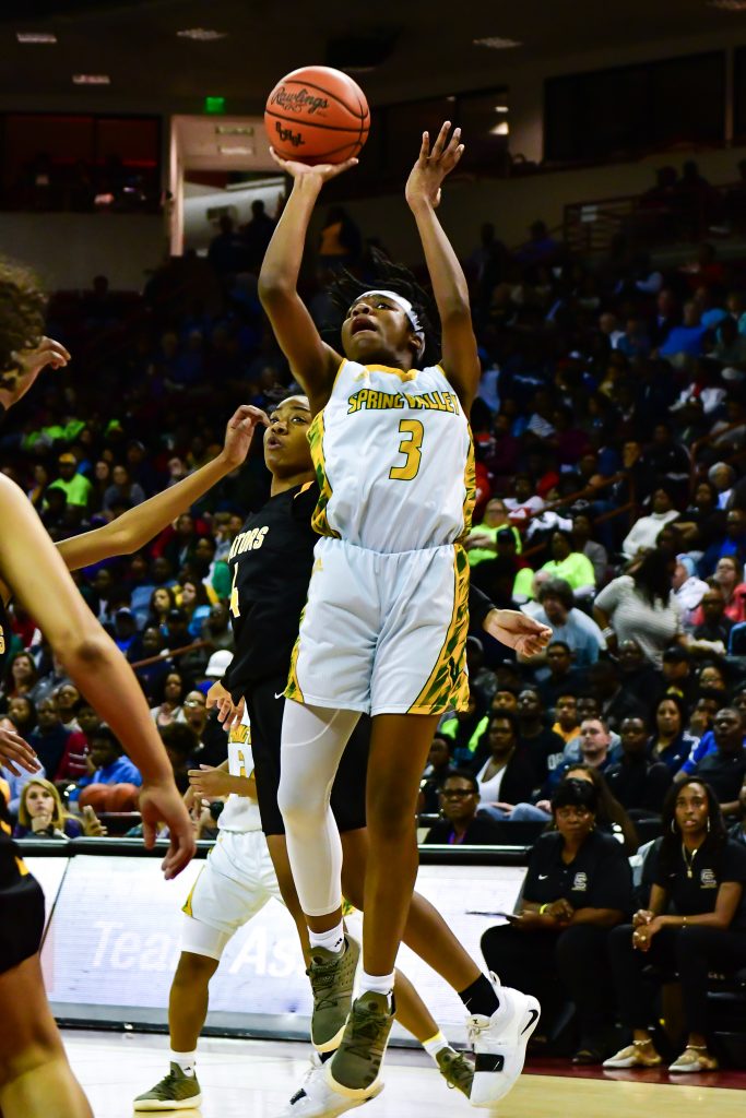 Spring Valley’s #3 Taylor Lewis fires off a jump shot at the girls’ basketball state finals.
