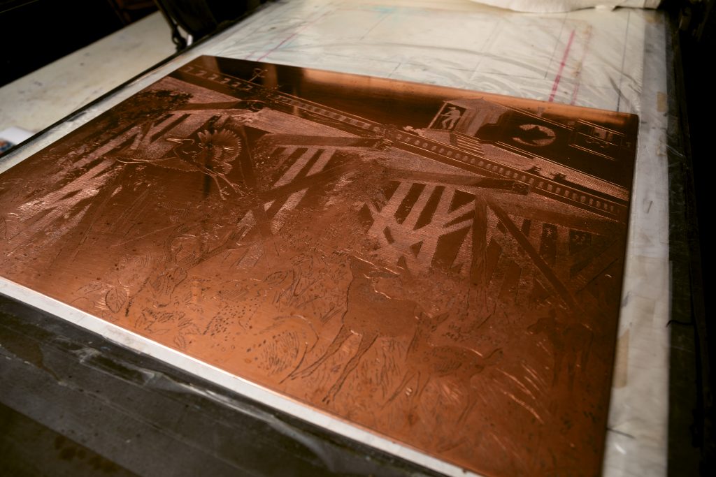 Creating a detailed etching in copper is a complicated process involving acid, engraving, and other procedures designed to lower the image into the surface of the plate.