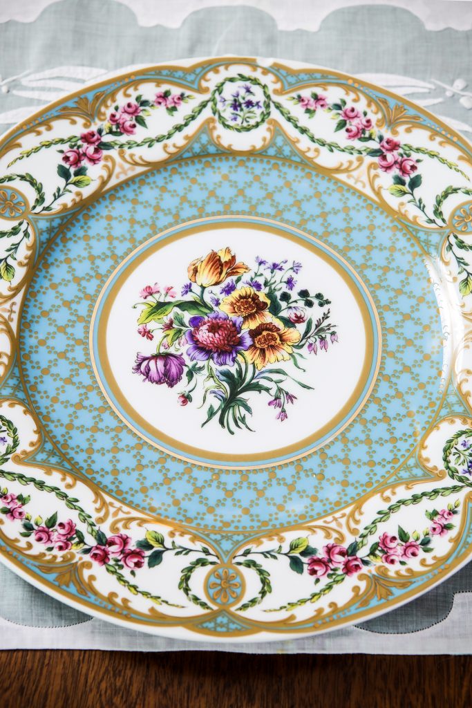 This heirloom porcelain dinner plate takes the spotlight for an elegant evening supper. Candlelight will highlight the family crystal mixed with recent purchases. Use Grandmother’s antique Chinese embroidered organdy place mats with your new linen napkins. Create a feast for the eyes!