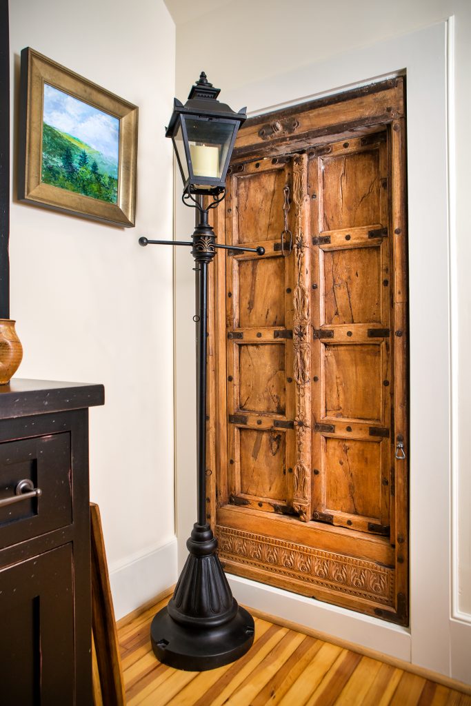 The whimsical wooden door to the basement and the lamppost are a nod to The Lion, The Witch, and the Wardrobe. 