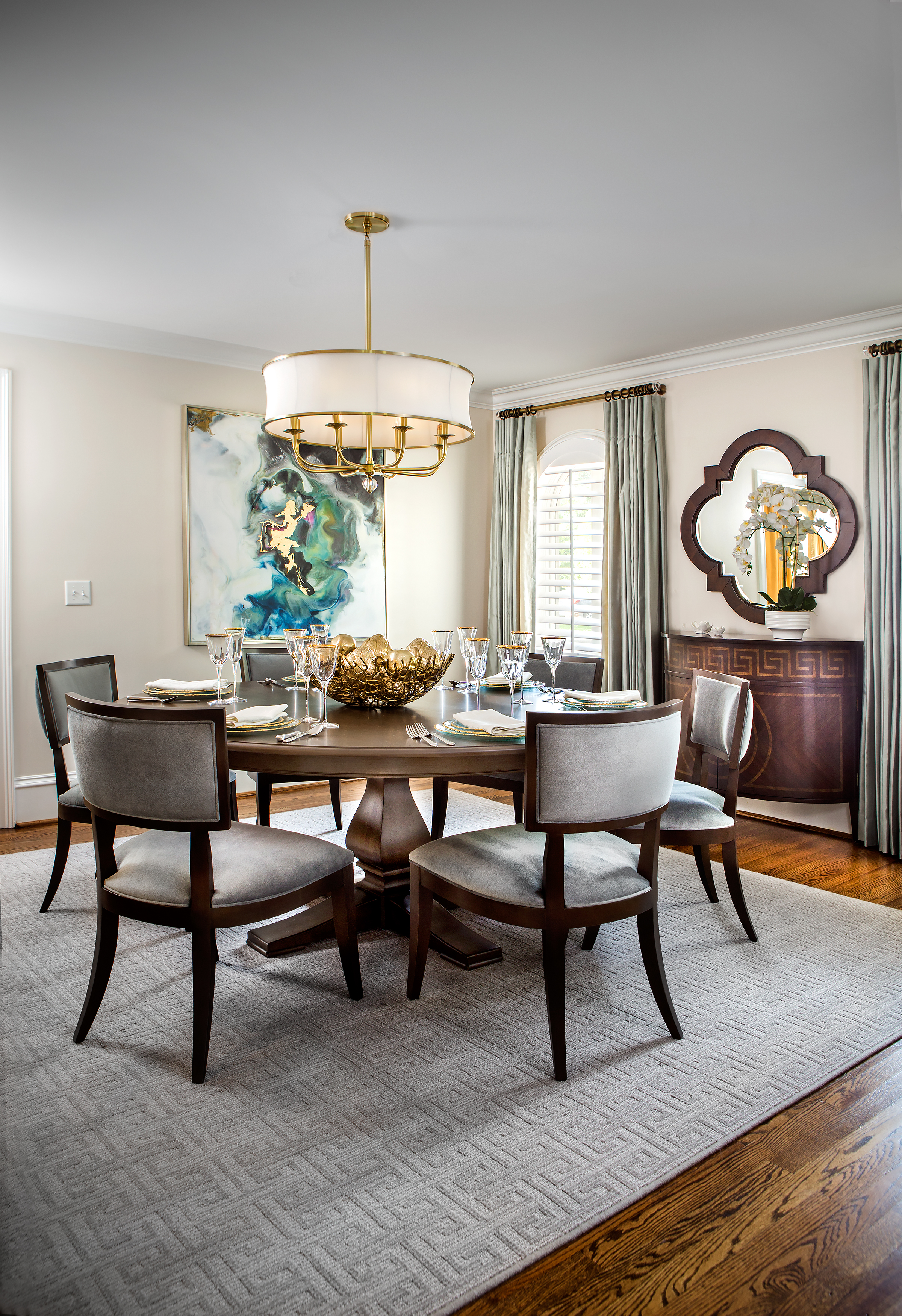 Terri Veitinger of Ethan Allen designed the dining room with understated elegance, inviting guests to “come in and sit down.” The 72-inch round dining table is perfection for the space, resting on a square rug.
