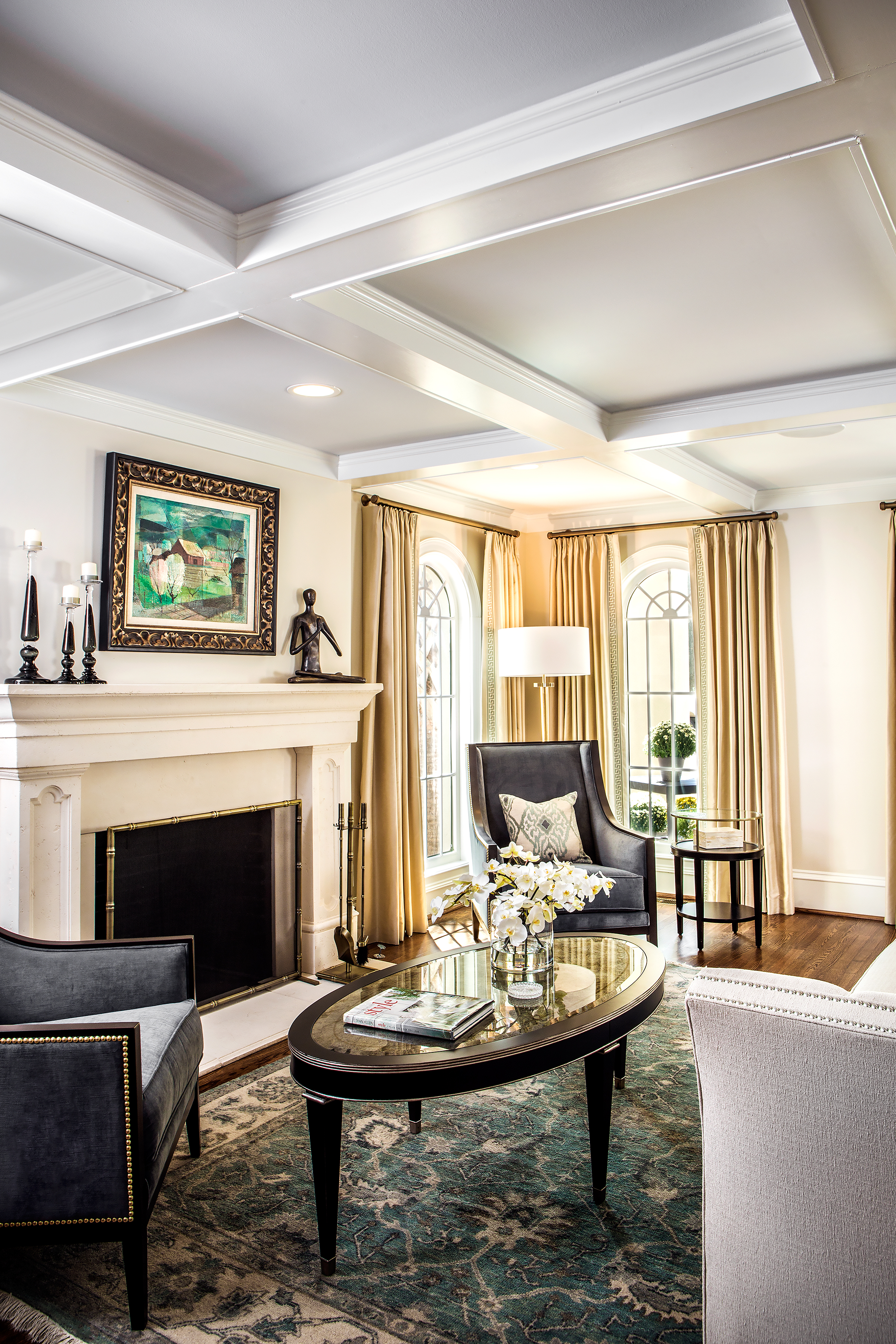 The coffered ceiling in the living room architecturally defines the space, and the gracious arched windows purchased by Brenda eight years ago are beautifully incorporated into the renovation.