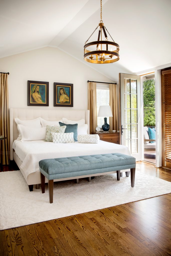 Stunning teal accents highlight the spacious master suite, which opens onto a sunny porch where Brenda enjoys life on the corner of historic Heyward Street and Saluda Avenue.