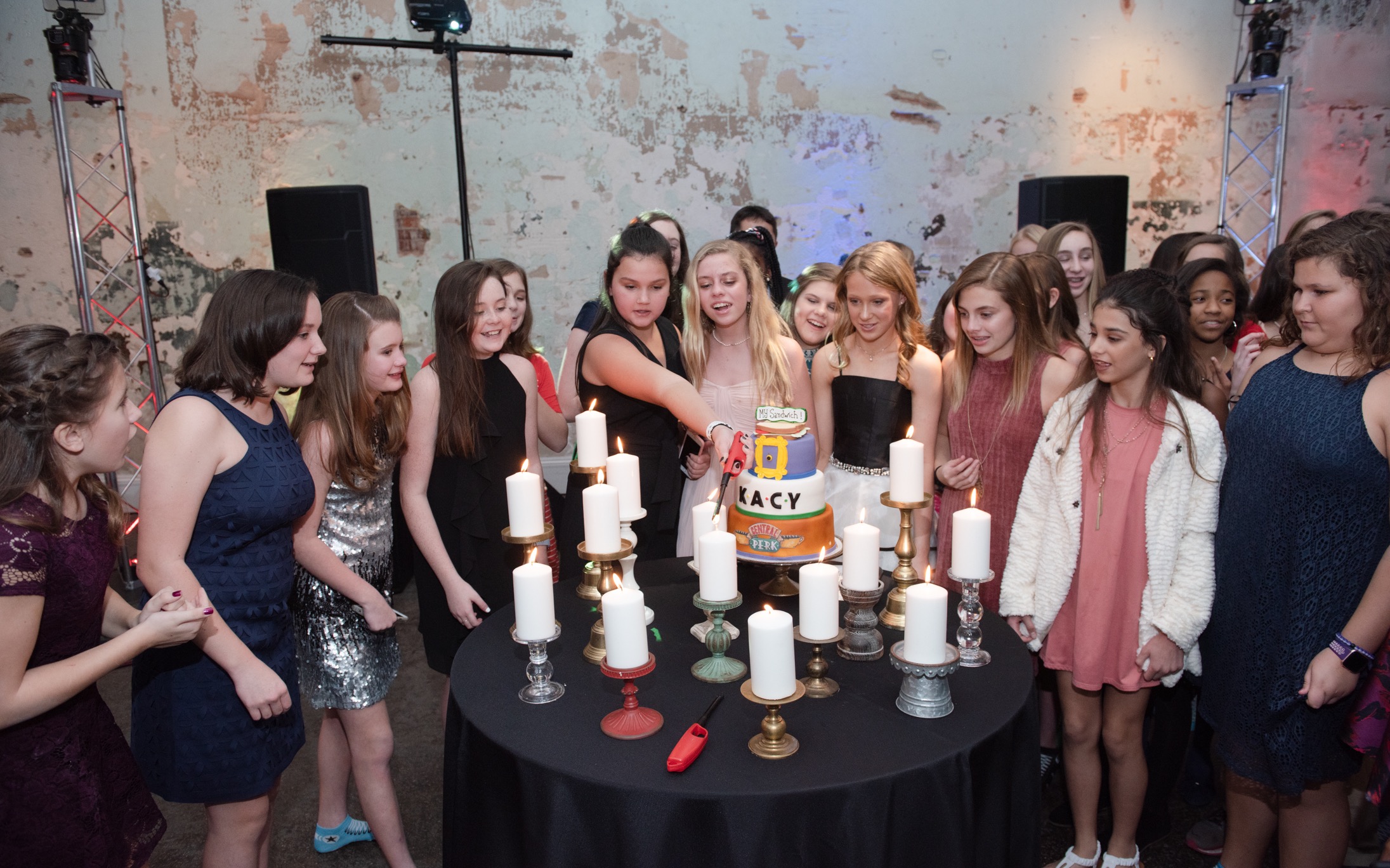 A candle-lighting ceremony is traditionally held during the bat mitzvah festivities in order to recognize family and friends who have had an impact on the celebrant. Kacy invites her friends to light a candle.