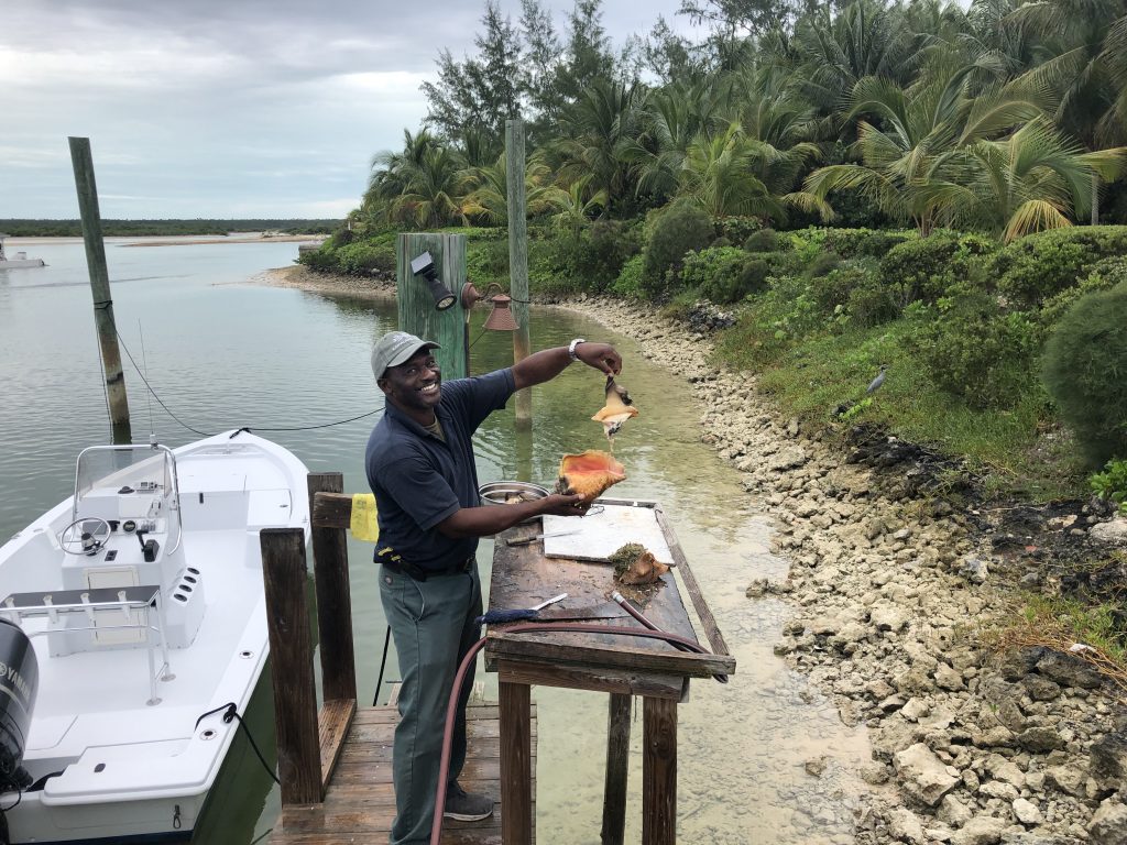 Mike, who’s been with the resort for 30 years, expertly removes the delicious conch meat from its shell.