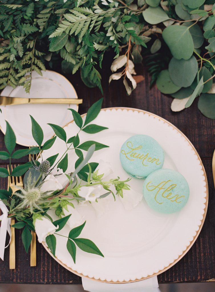 Beautiful hand-painted macarons, prepared by the Script Shop and Prep Confections, adorned the bridal party table. 