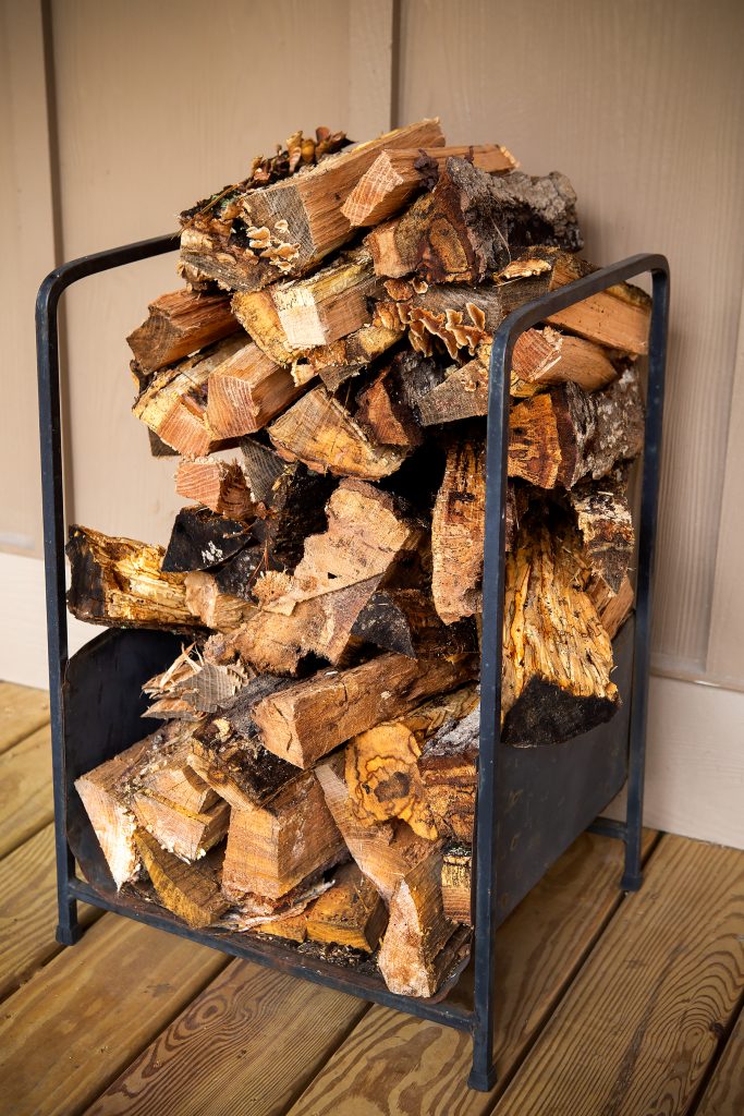 Freshly cut wood is used in the wood-burning stove.