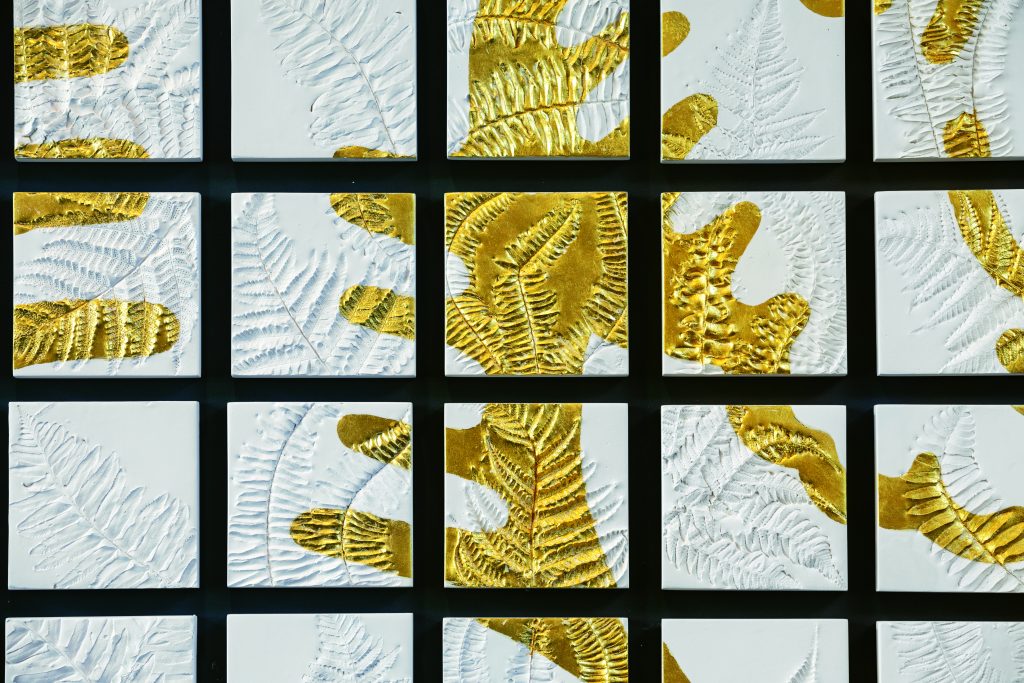 This 170-piece art installation comprises a 10-foot by 7-foot space in Columbia’s Hotel Trundle lobby. Made with locally sourced fern fronds, each plaster element is different in composition, showing the delicate and unique nuances among each organic frond. The gold leaf is a 22-karat gold from Manetti of Florence, Italy. 