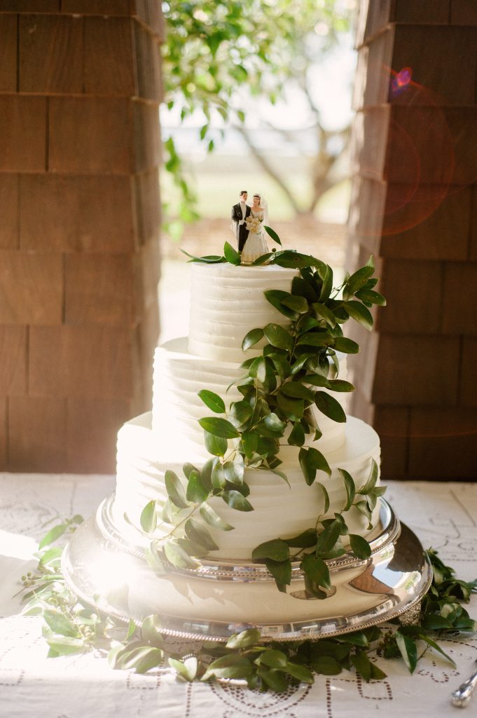 The three-tier cake dressed in smilax from Ashley Bakery showcased the same topper from the wedding cake of Mary’s paternal grandparents, Nola and Jim Covington, who married more than 60 years ago. 