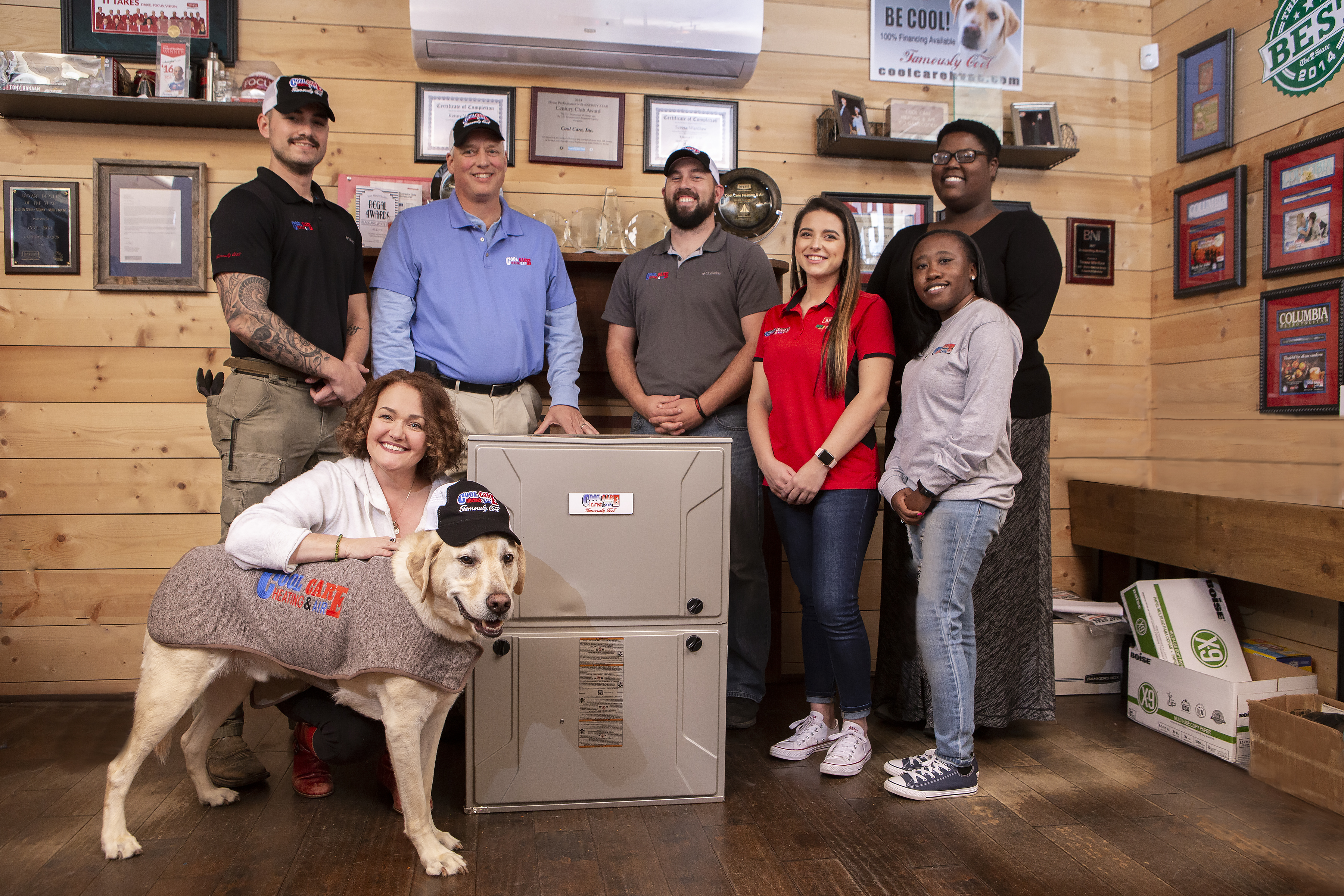 The team at Cool Care Heating & Air gathers around a five-ton gas furnace with their mascot of eight years, Top Dog Ballou Savage, to celebrate Best Heating/Air Service. Teresa Wardlaw with Top Dog Ballou Savage, Josh Savage, Kenny Wardlaw, Andy Potts, Savannah Shrader, Feonnia Johnson, and Kim Maxon.