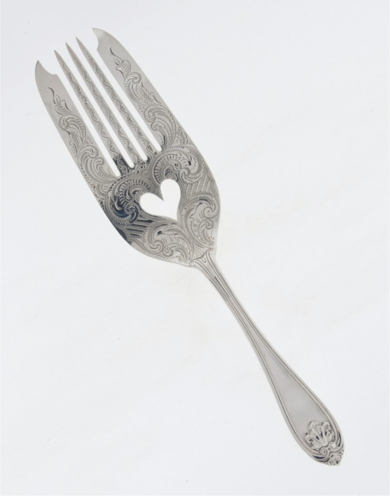 Serving Fork, circa 1855, Radcliffe & Guignard (silversmith). This ornate serving fork pierced with a heart shape and engraved with the monogram “SLP” under the handle belonged to Sarah Lyles Poellnitz. She was the daughter of Thomas Minter Lyles and Eliza Roselyn Peay of Lyles Quarter, Fairfield County. Photography Courtesy of McKissick Museum, University of South Carolina.