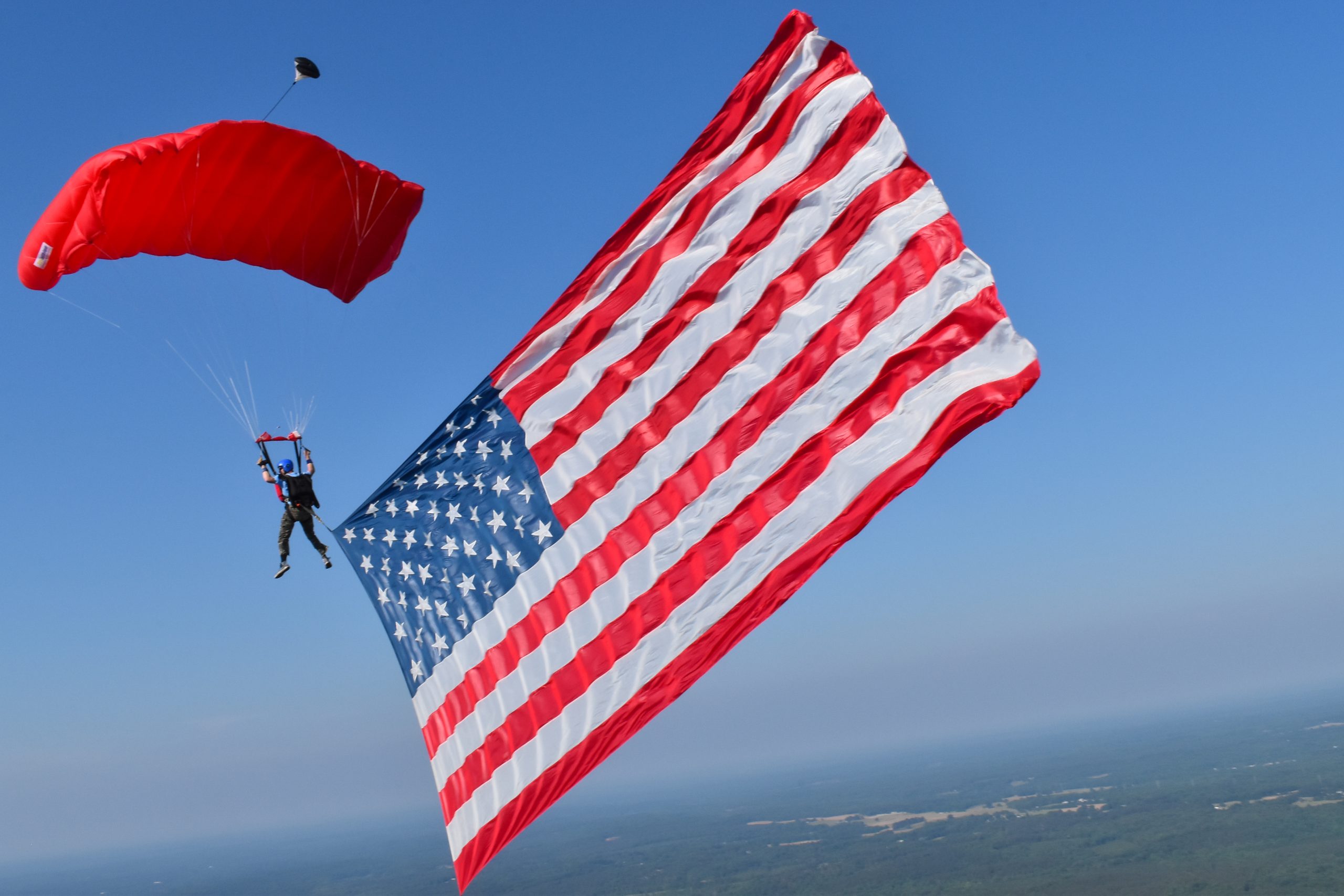  CarolinaFest, held at Skydive Carolina, is one of the premier skydiving events held in the United States.  More than 450 jumpers will typically exceed 6,000 jumps over six days. Each day begins with a “flag jump.” Photography courtesy of Quincy  A. Kennedy, IV.