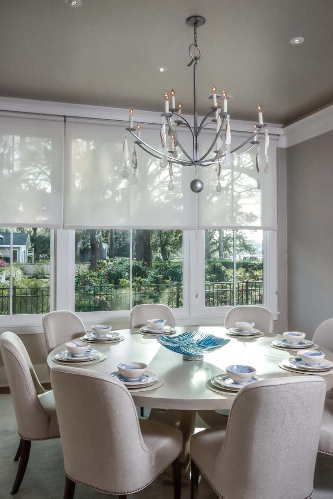 With Linda’s guidance, Terri chose a simple but elegant round dining table that seats eight.  The overall marsh views also incorporate a panorama of the neighbors’ heirloom camellia and azalea garden. The dining chairs made of linen with nail head trim are custom made by Tritter Feefer. 