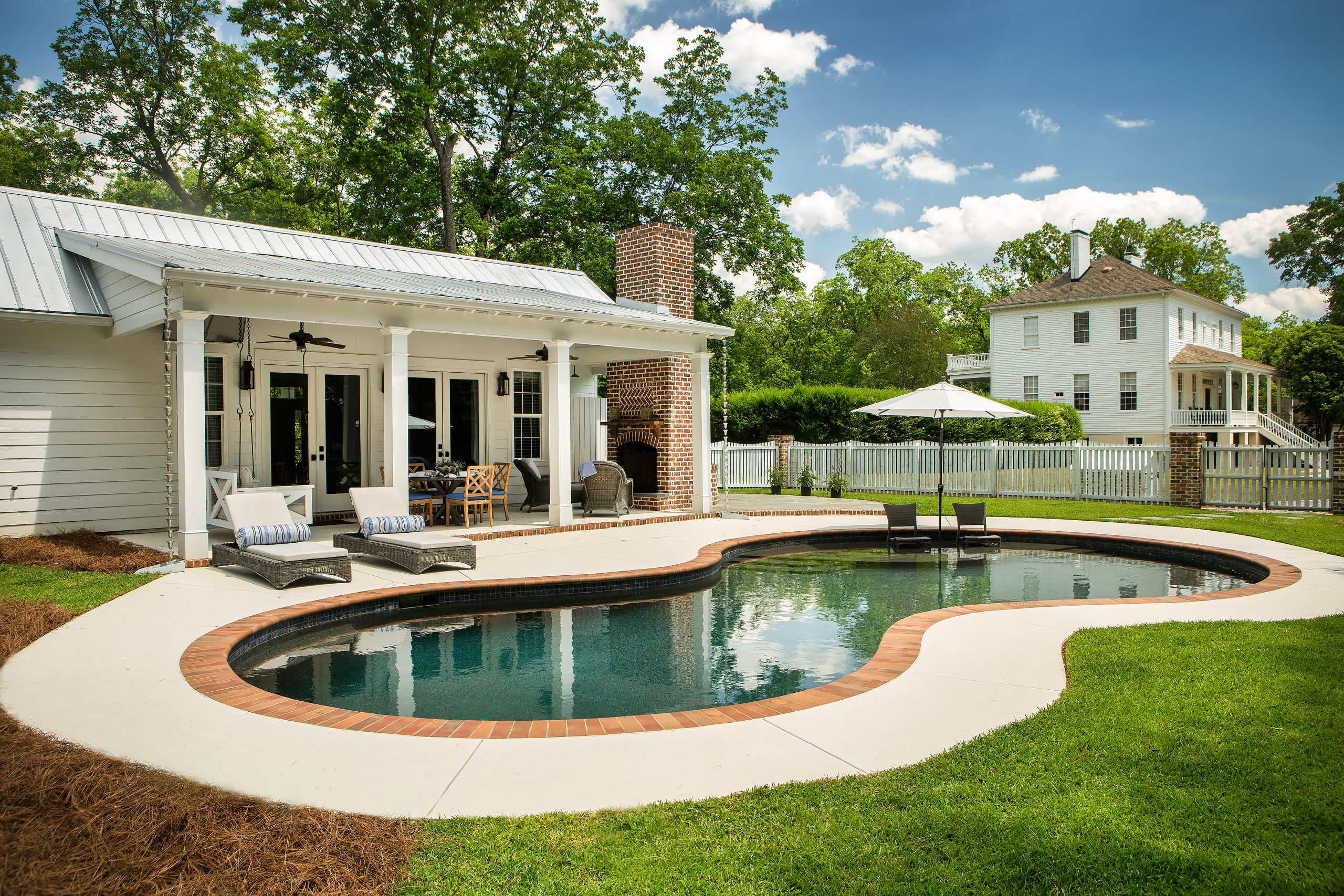 Two years ago, the Barnwells added a pool and pool house in the back yard. Landscape architects Ken Simmons and Drew Cheatham designed the structure to complement the historic buildings.