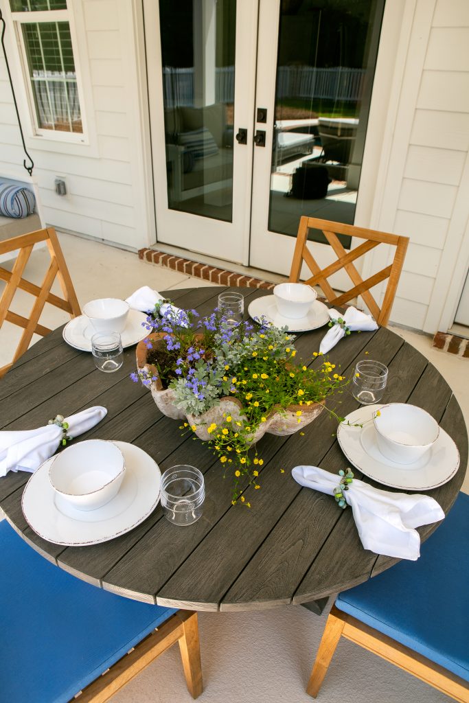 The pool house in the summertime is perfect for outdoor dining and grilling. 
