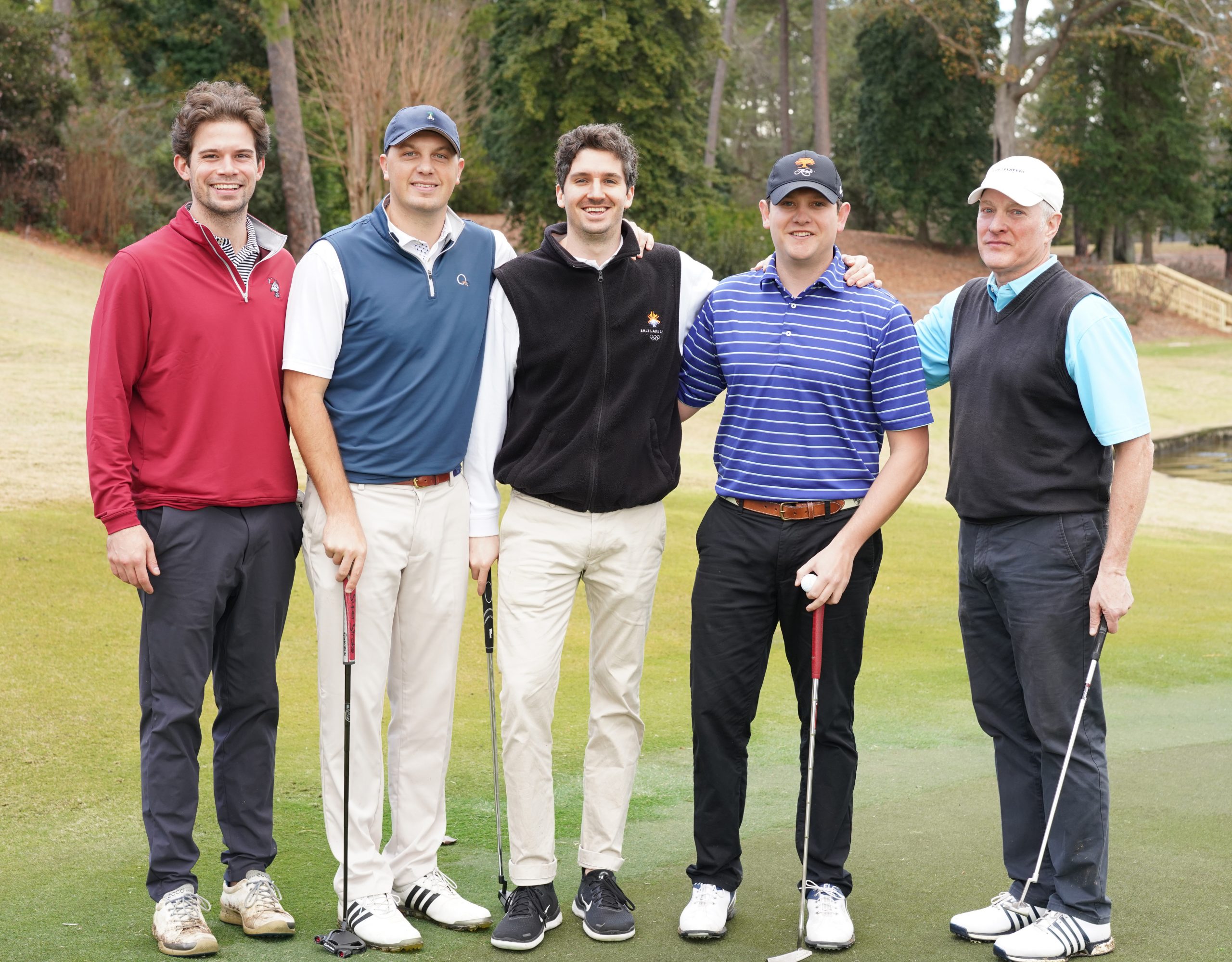 Wes Davis, Hub Blankenship, Shane Sniteman, Benson Jones, and father of the groom Boyd Jones tee off the wedding day with golf and a lunch hosted by friends at Forest Lake Club. 