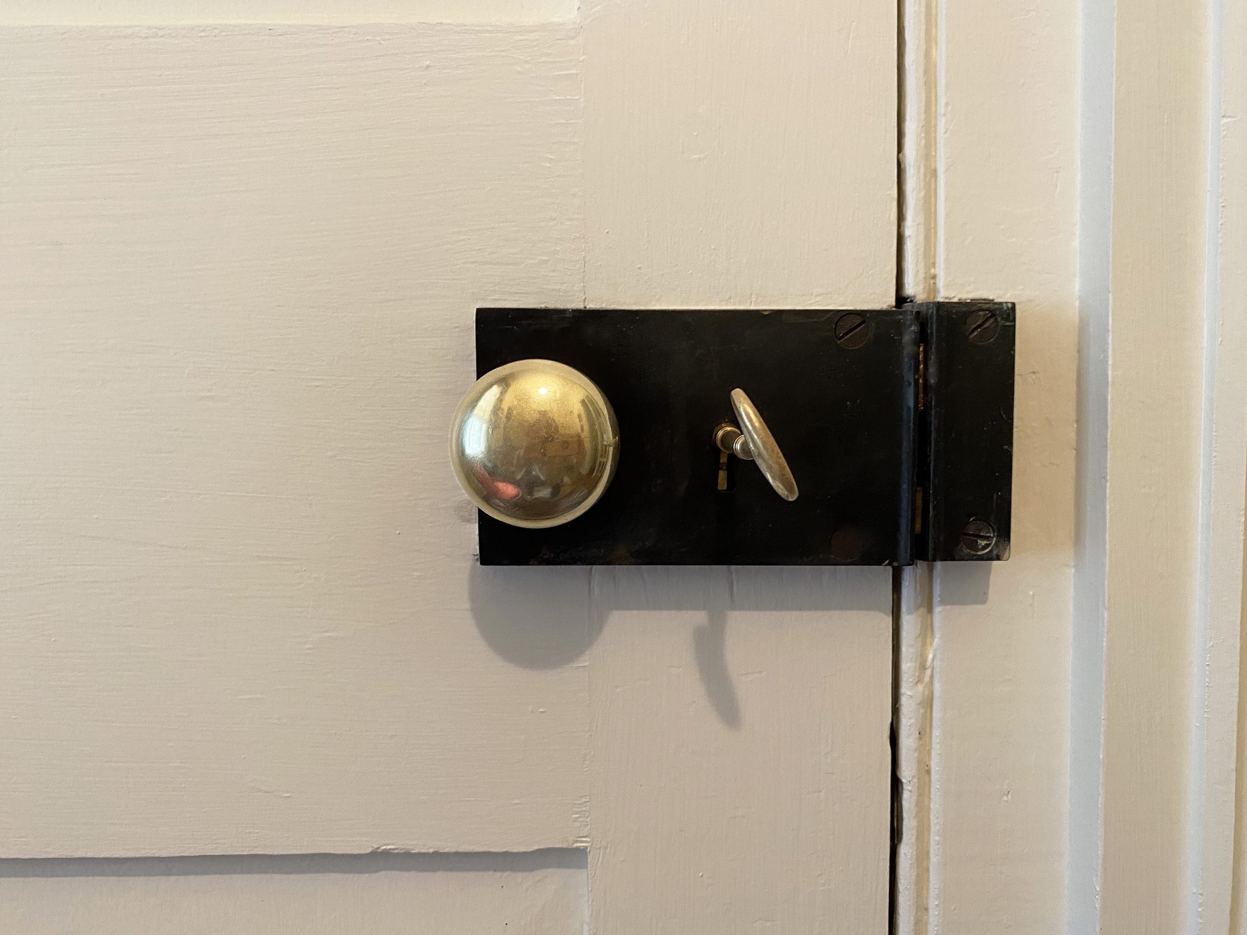 The doorknob and key in this old English lock will benefit from daily use, thus not requiring polish as often. 