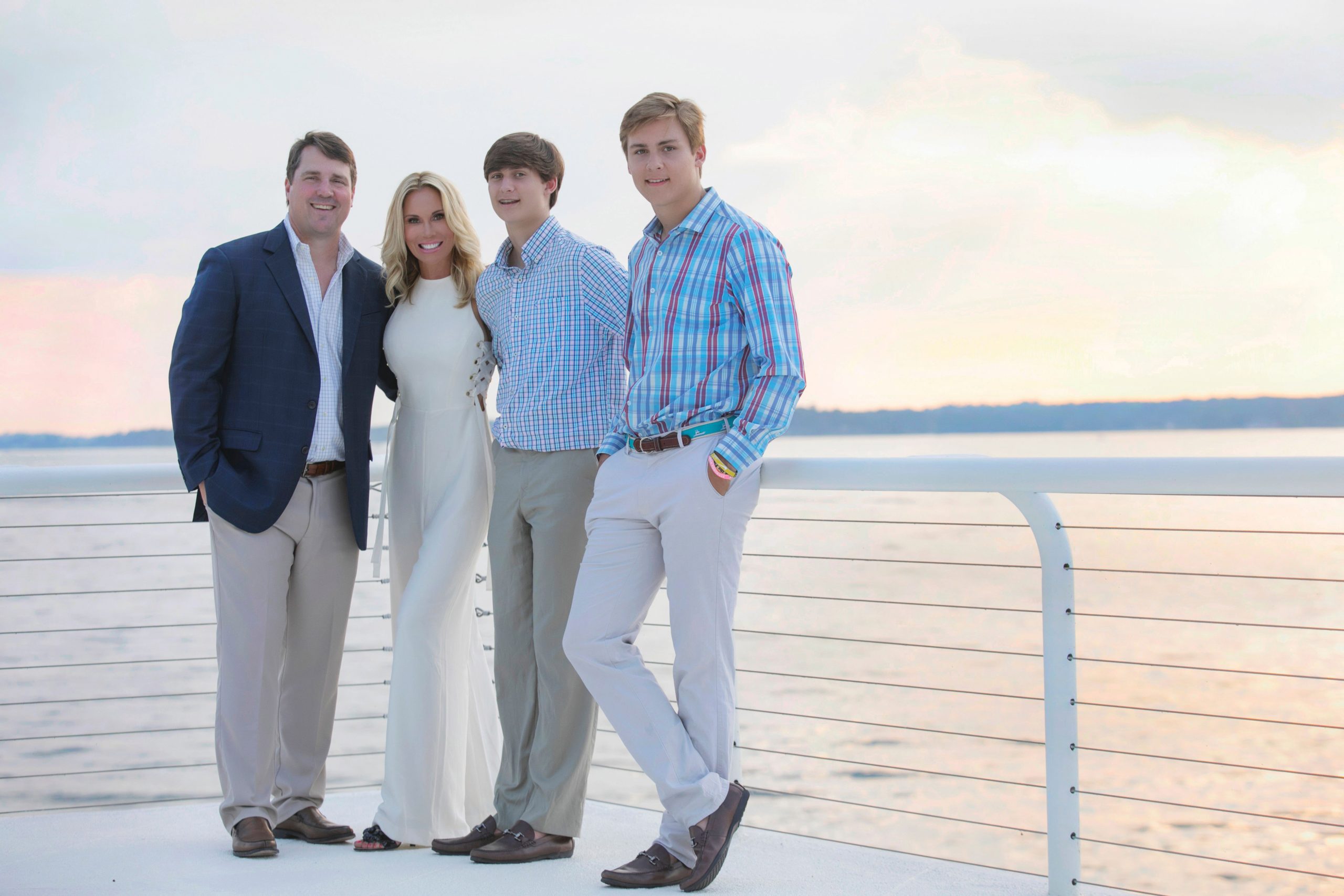 As the head coach’s wife, Carol Muschamp has an additional responsibility. “I want the other coaches’ wives to be happy because we couldn’t succeed without the work they do behind the scenes.”
Will Muschamp, Carol Muschamp, Whit Muschamp, and Jackson Muschamp.