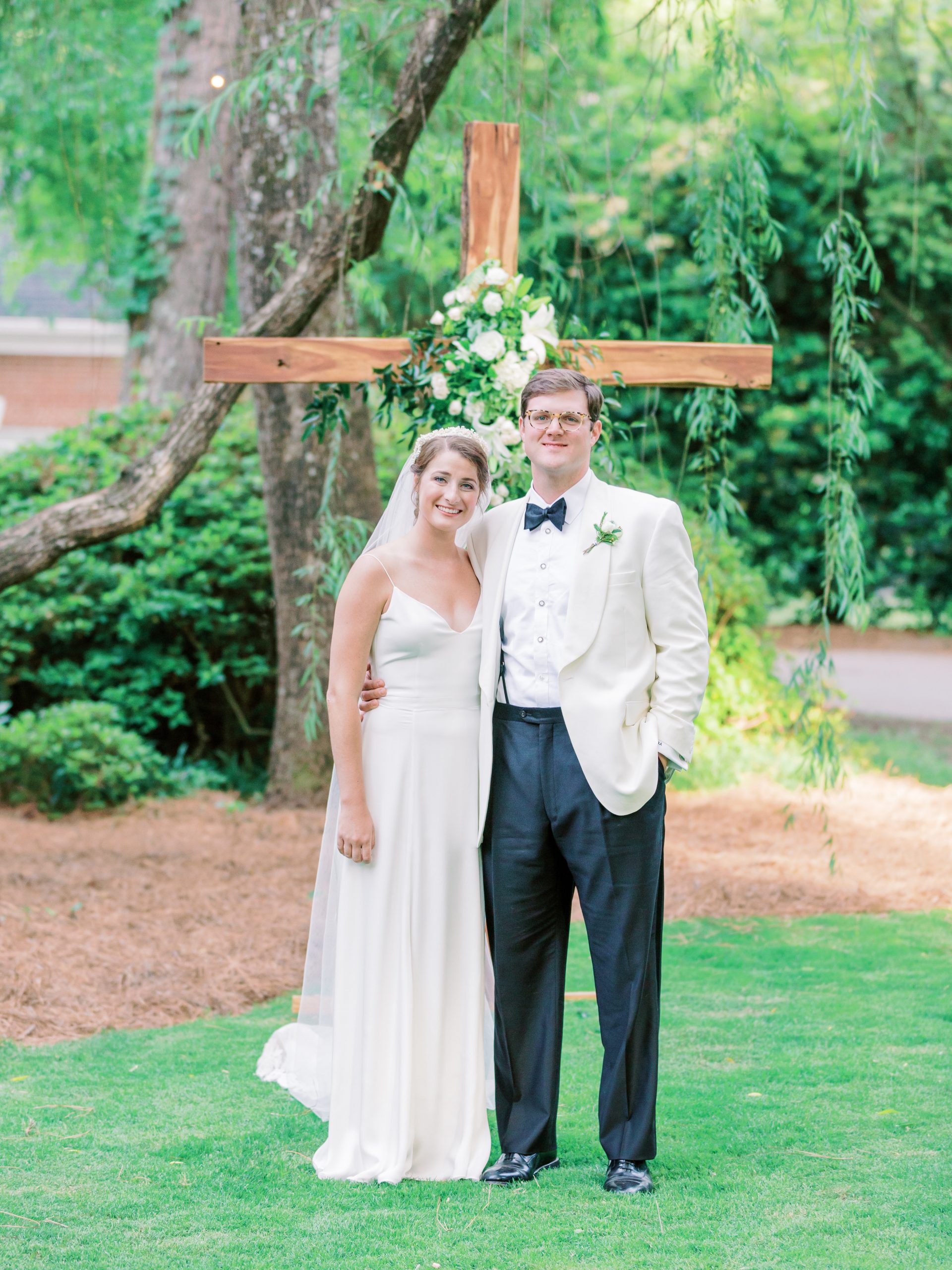 Mary Etta Castles and Edward Able enjoyed a backyard wedding on May 9 at the home of the bride’s parents, Libby Lee and Guy Castles. Special memories include a cross made by her brother, Guy, of timber from the family farm, the first dance on the patio, and the cake cutting next to her childhood playground. Photography by Karlyrichardson.com 
