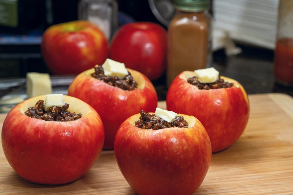 When preparing Honey Baked Apples, apples should be cored to make an apple bowl. Fill the cavity with chopped toasted walnuts or pecans combined with seasonings.