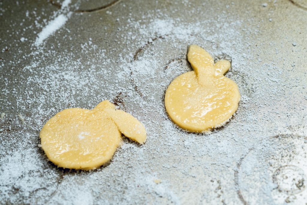 Premade pie dough can be rolled and cut into desired shapes for decorating the apples. 
