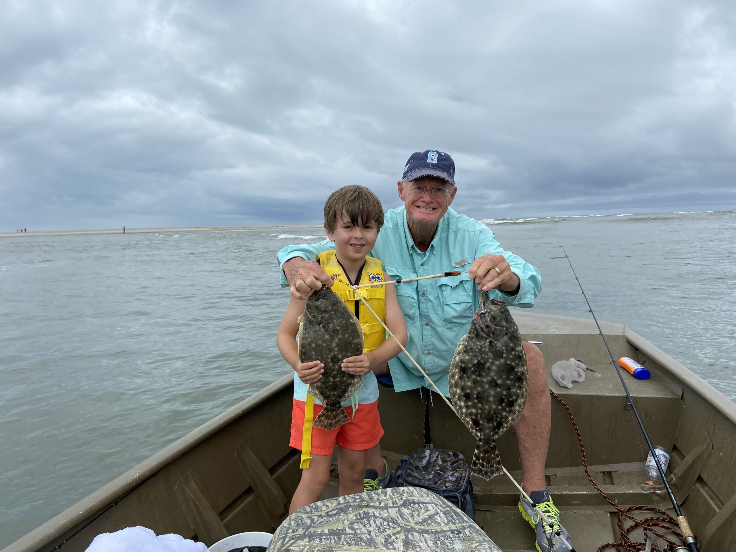 Claude’s son, Townsend, enjoys a flounder expedition at Pawleys Island with his grandfather, Bill Calloway.
