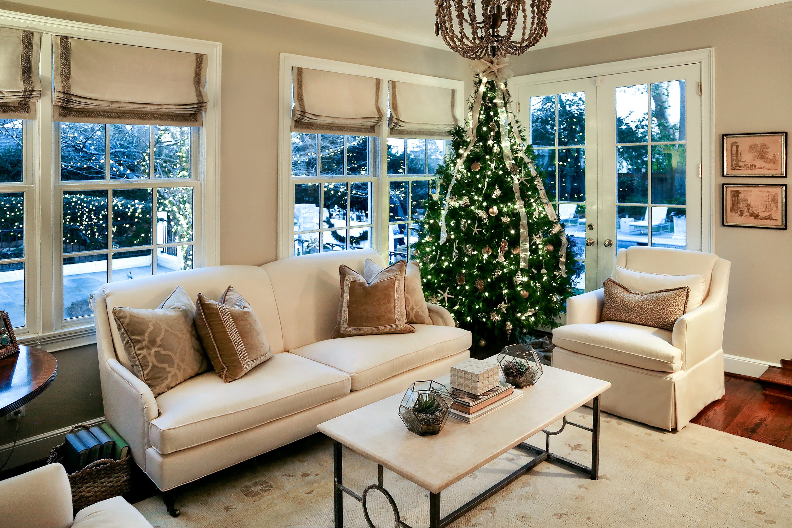 Originally from Mount Pleasant, Rebecca decorates the sunken sunroom with a coastal-themed tree decorated with sand dollars, starfish, and shells.