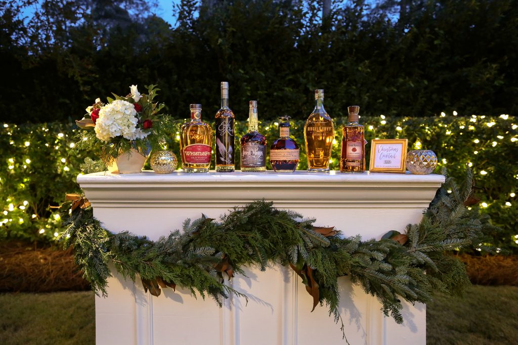 In the backyard amid sparkling lights near the saltwater pool, guests are treated to an extensive bourbon bar. A perfect bracer for a cold winter night! 
