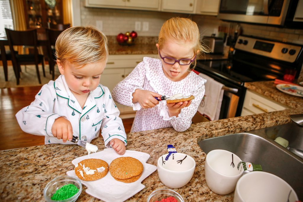 Katie and Adam Schanzs’ children enjoy making homemade cookies for Santa. After rolling out the dough and baking with her dad, the fun begins for 5-year-old Quinn, who enjoys decorating and tasting the icing herself. One-year-old Barret is happy to help!