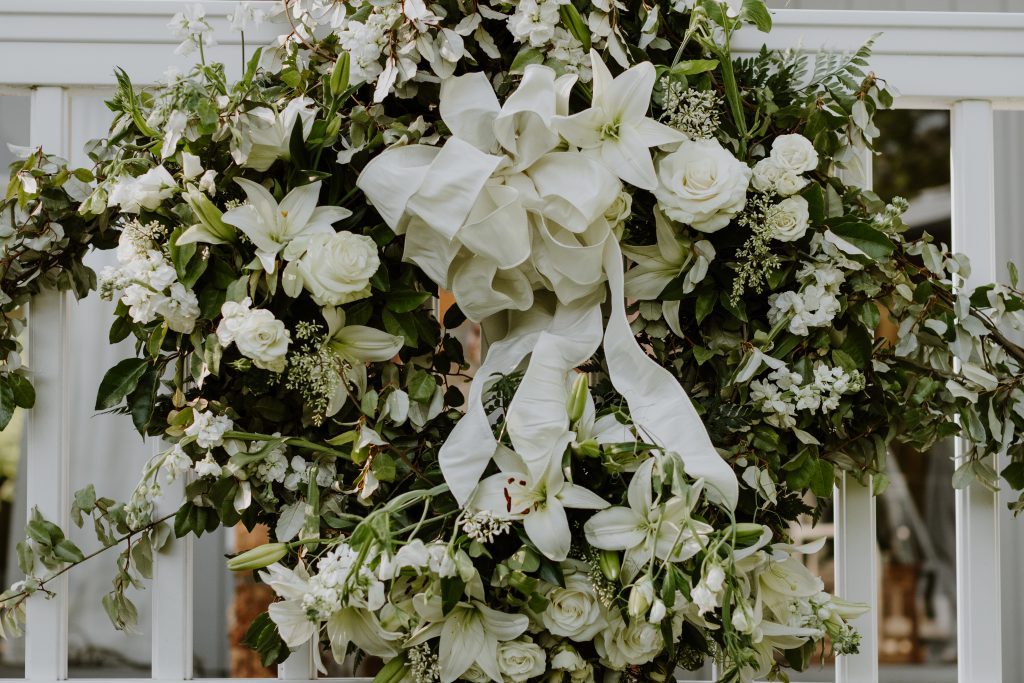 A group of the Kneeces’ neighbors gave the beautiful wreath by Cricket Newman Designs, which hung dockside during the wedding day celebration. 