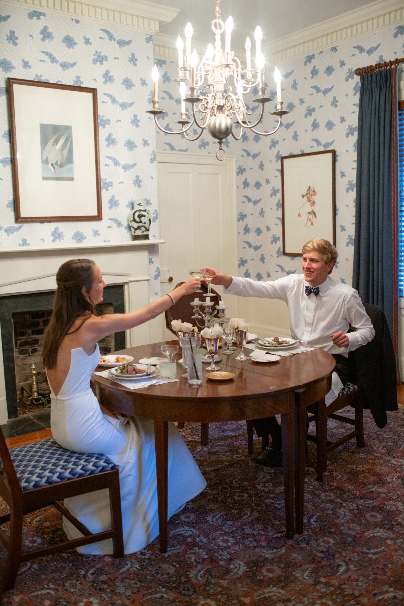Emmy and Davis enjoyed their own private intimate dinner inside the Exchange dining room, sampling the menu. Emily surprised her daughter with a table set with family china, silver, and crystal along with a place card with her new name. 
