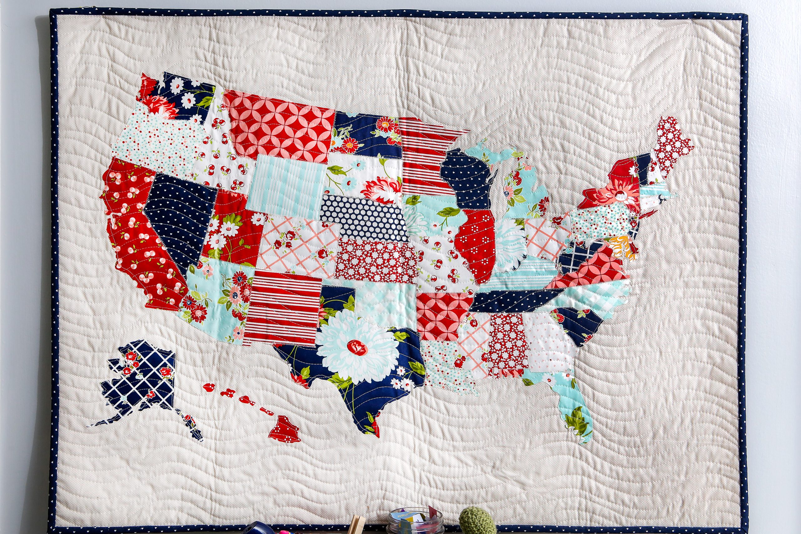 Wavy line quilting provides the background for the American flag quilt made in 2017. 