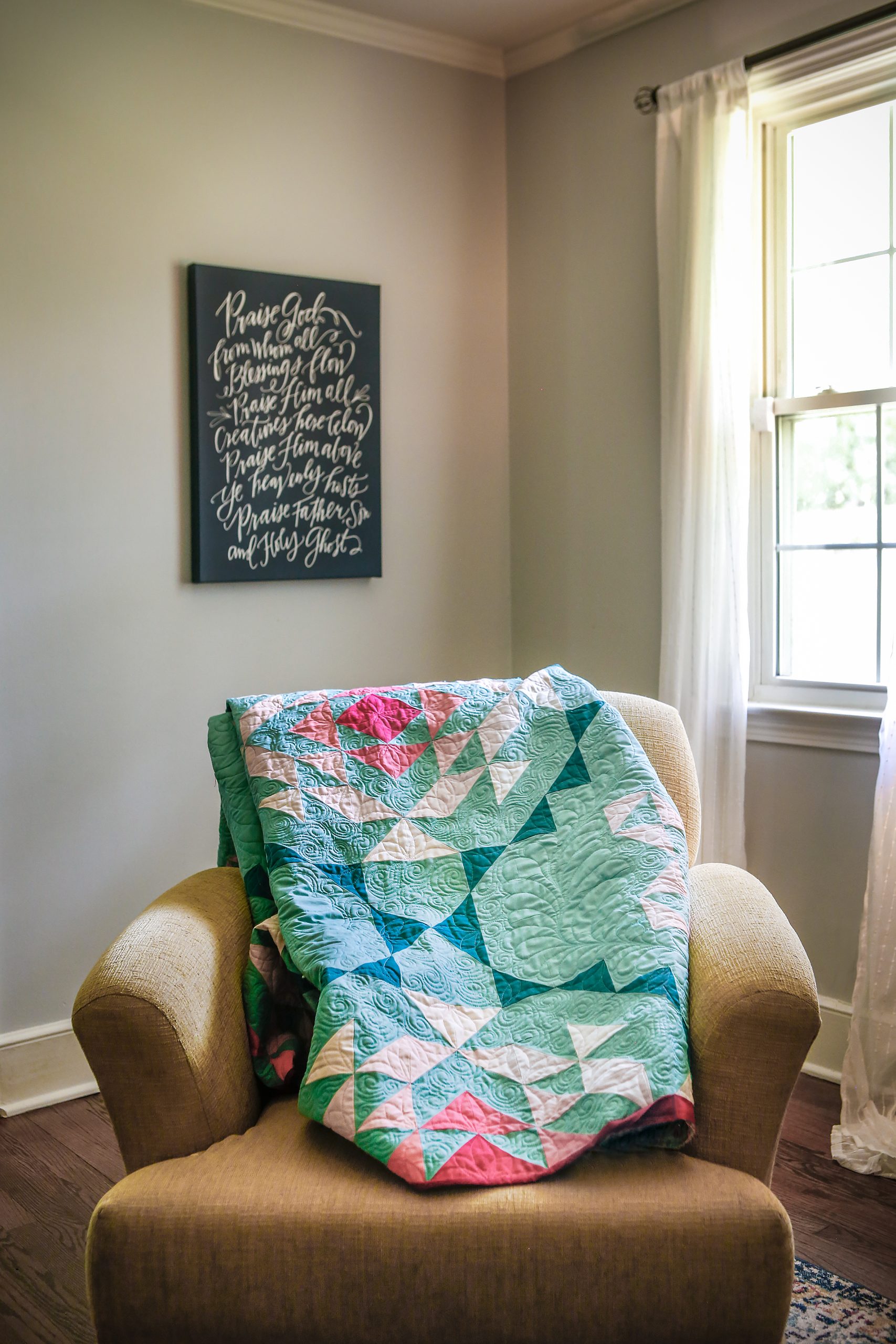 A beautiful example of custom quilting with feathers made by Kristy Rollins.