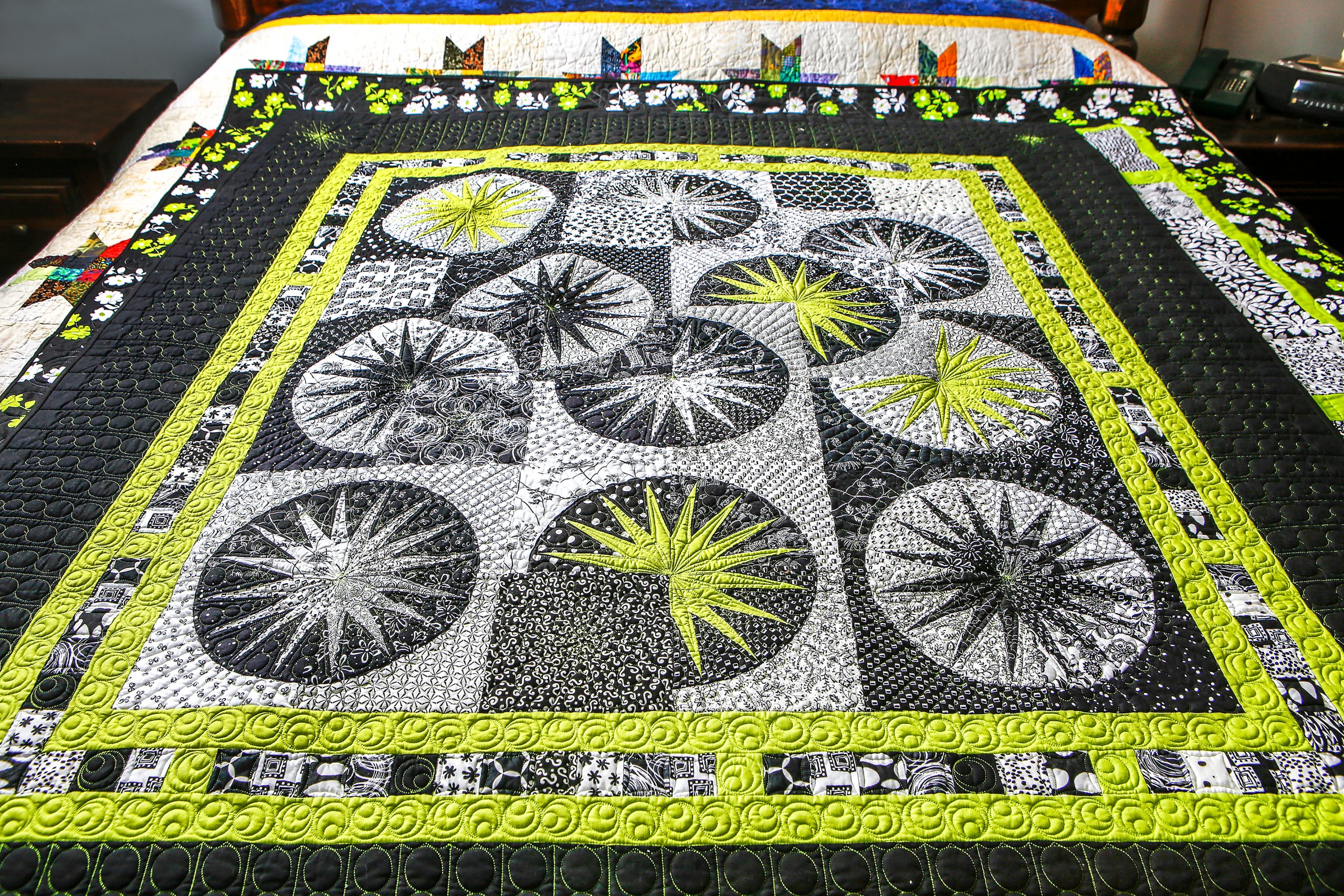 An award-winning quilt called “Gin and Tonic with a Touch of Lime” is constructed with a technique called paper piecing. 