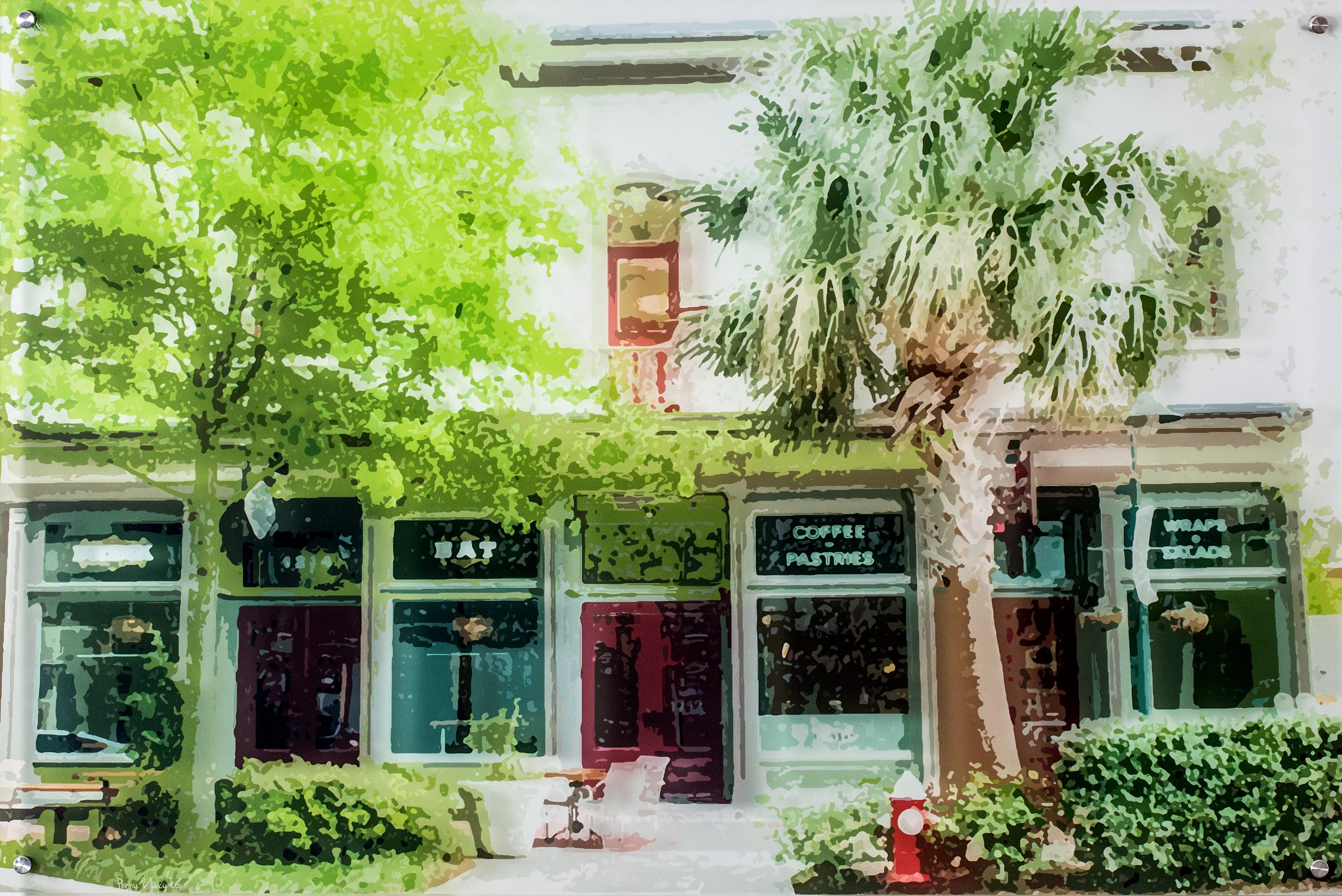 In the den area, a photograph of local storefronts transferred to acrylic by Columbia artist Penny McPeak from Penny and Lucy Lou Art blends the overall colors of the room. 