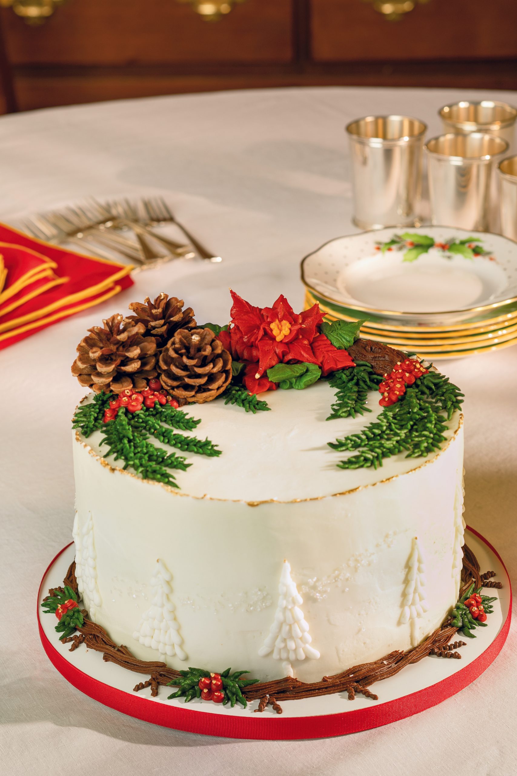 Bonnie Brunt Cakes’ sensational red velvet cake is festive on Herend Noel dessert plate with Carole Shiber Designs red and gold napkins, courtesy 
of non(e)such.