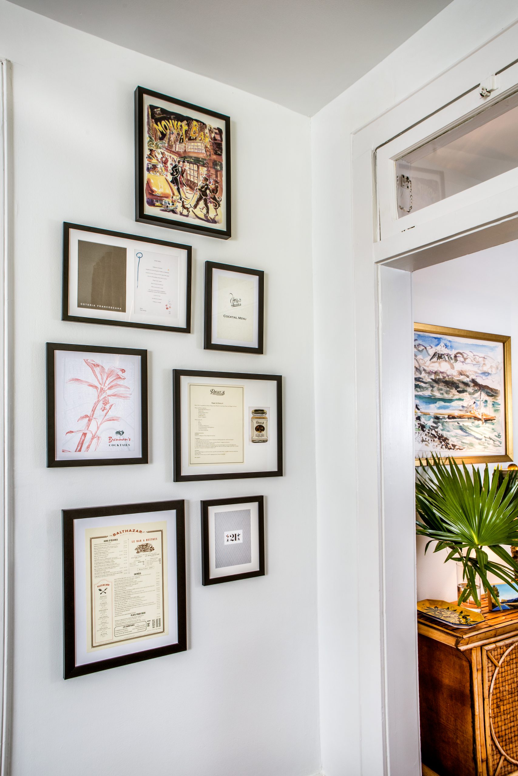 Framed menus, mostly from Mary Bond’s years in New York, flank the cased opening in the dining area. The collection was inspired by close family friends, the Kiblers, and is hung strategically to spark conversation about cooking and travel. 
